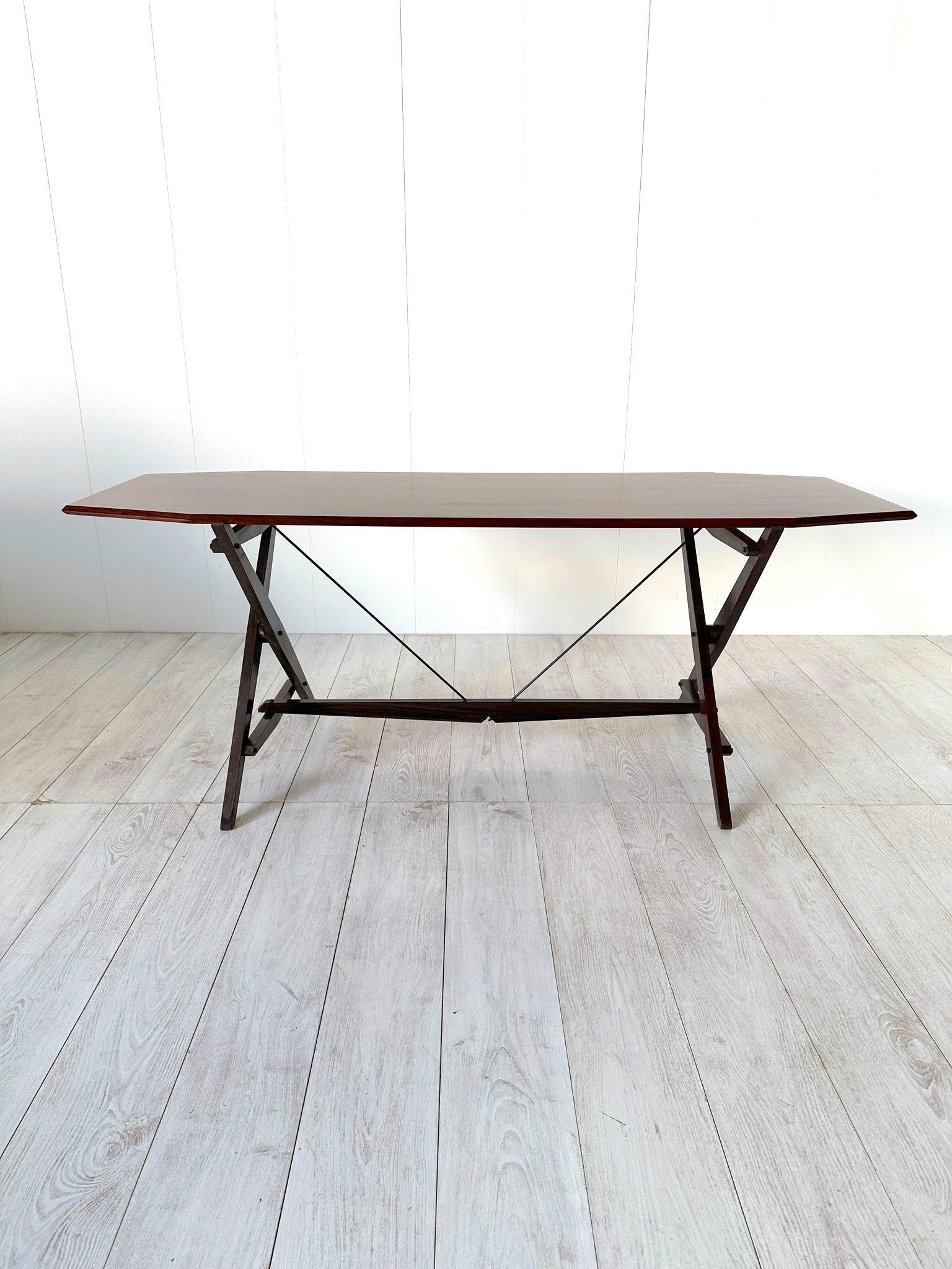 This table, with its minimal lines and an extremely light look, underscores the extensive thought, by Franco Albini, and the advanced wood-working skills, by Poggi, that went into its creation. Its stability based on the principle of opposing