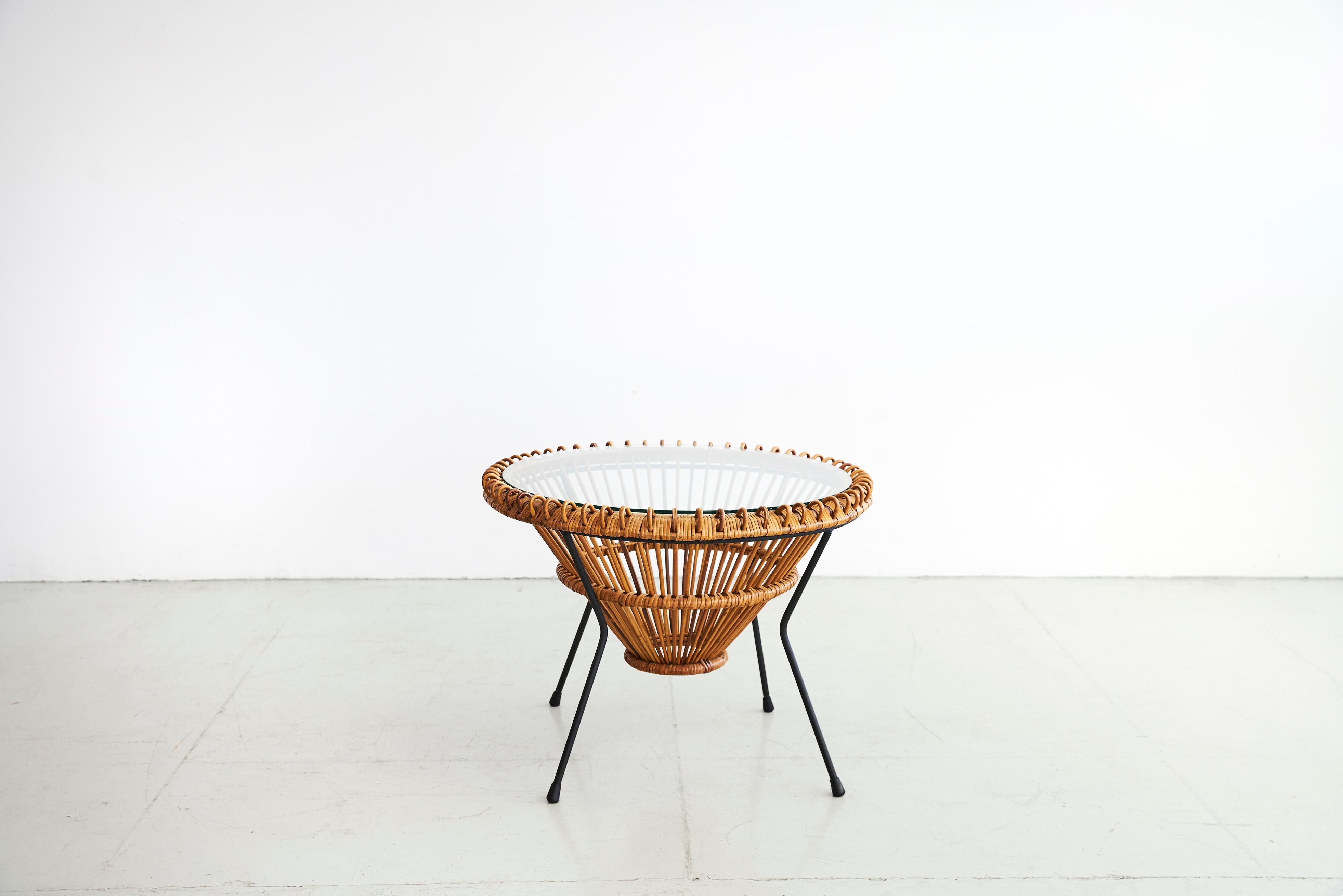 Beautiful pair of Franco Albini end tables. Great rattan detailing and iron base. Sold as a pair.