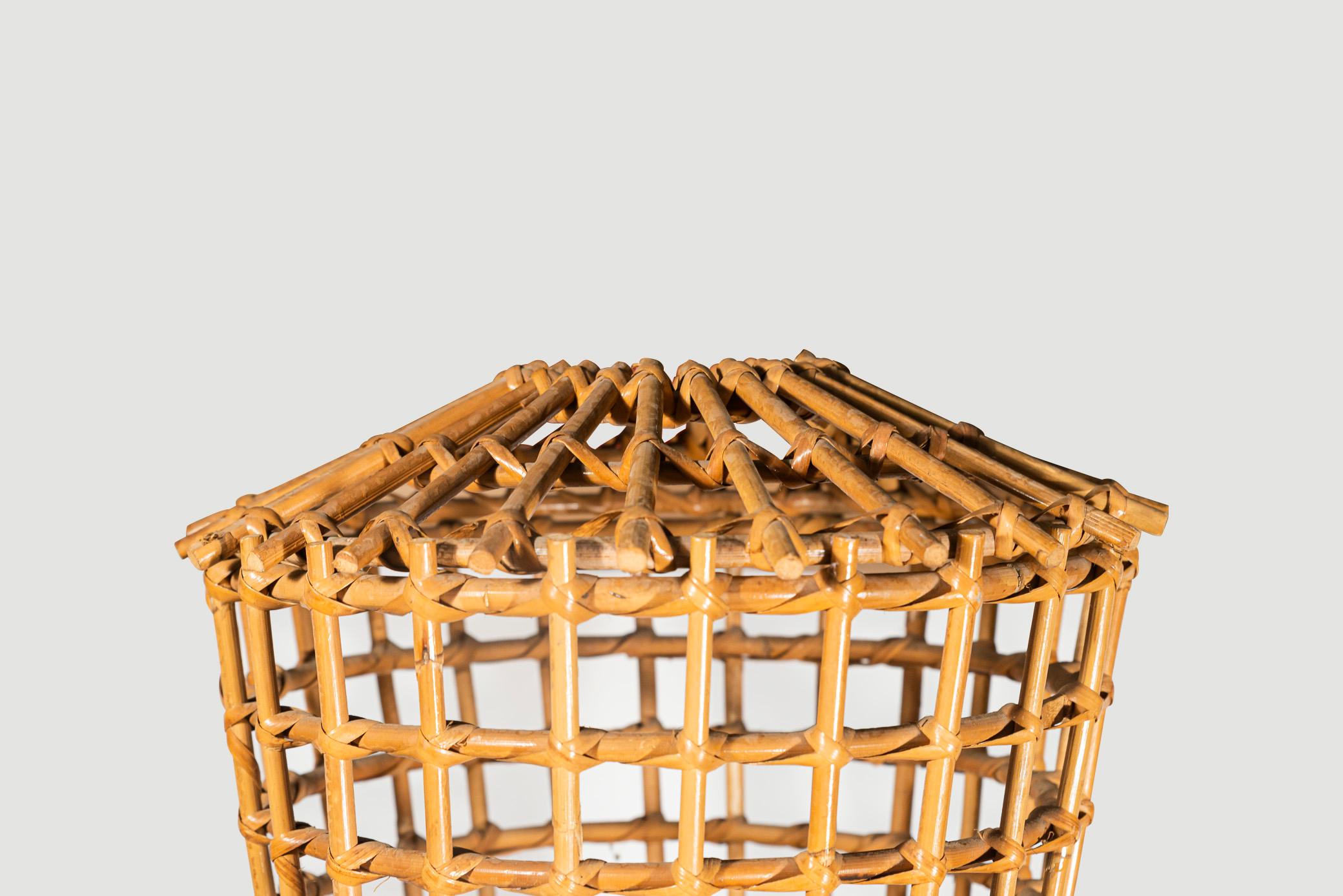 Franco Albini (1905-1977), Floor lamp,
Bamboo and rattan, 
Tripod base, 
the top of the lamp with bamboo decoration assembled forming grids,
Italy, circa 1960.

Measures: Diameter 39 cm, height 160 cm.

Franco Albini graduated in architecture from