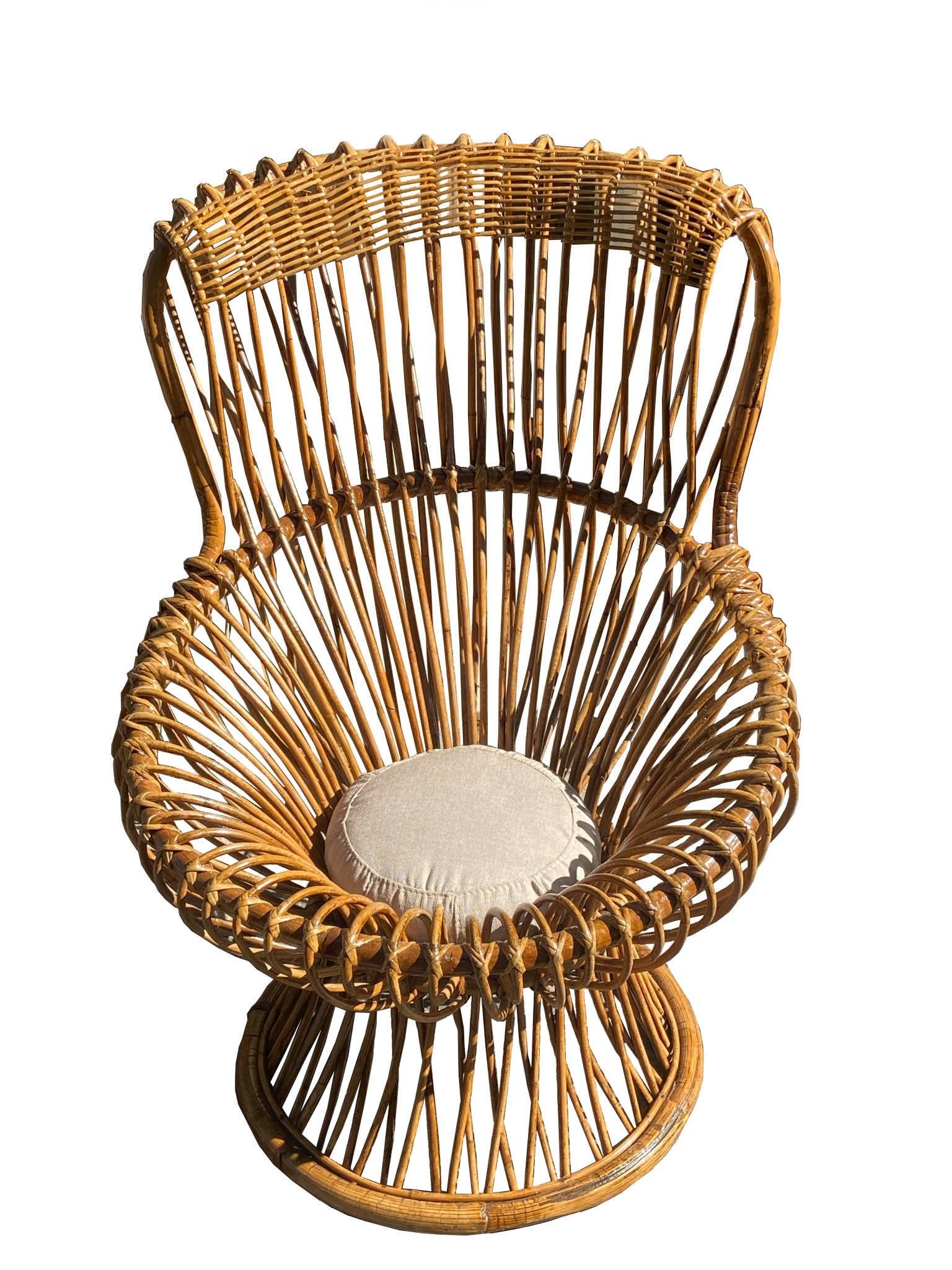 1950s Margherita chair in bamboo and rattan, designed by Franco Albini for Vittorio Bonacina, with cushion. Casual but elegant, the Margherita chair received the gold medal at the 9th Milan Triennale.
 