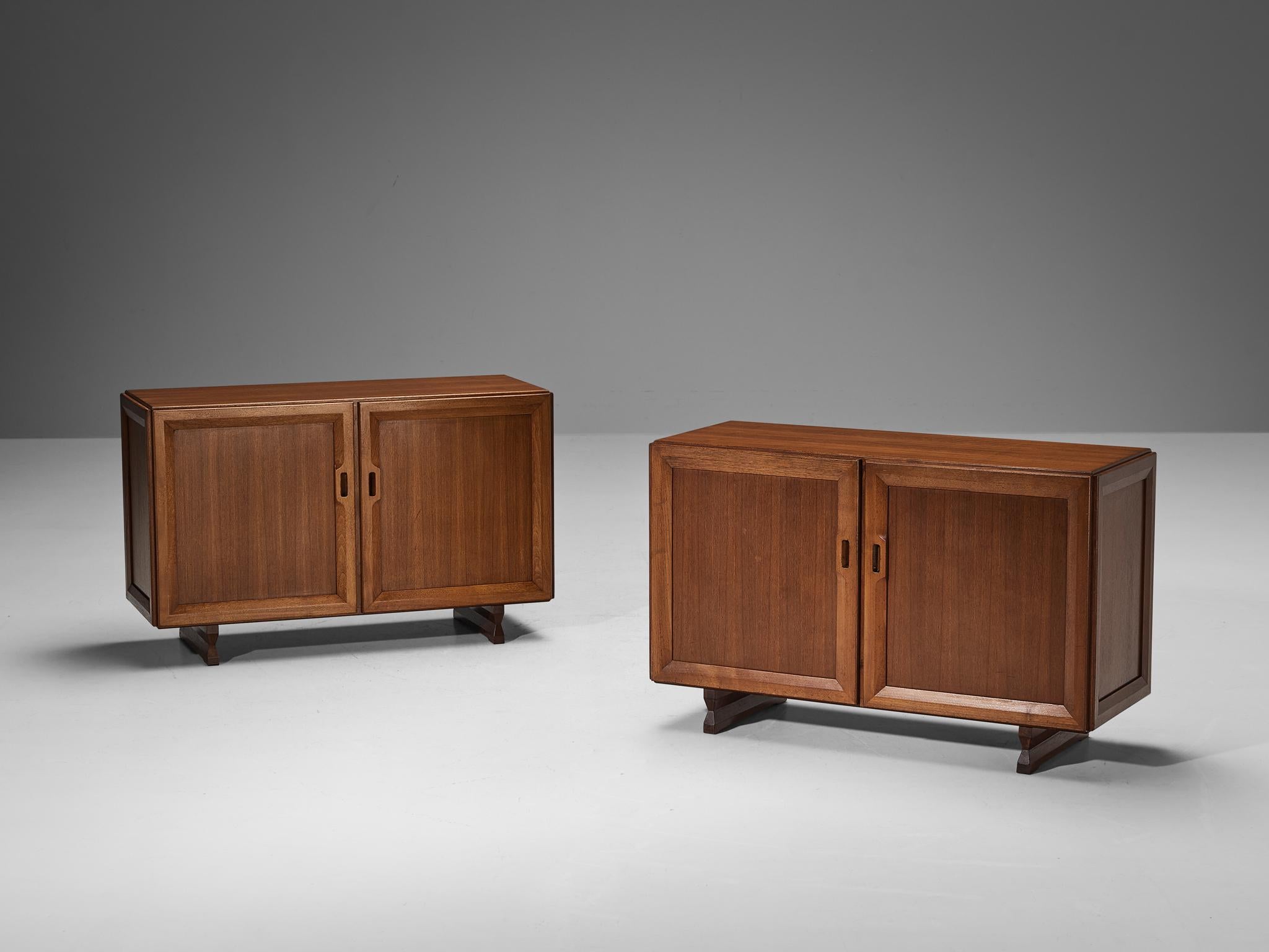 Franco Albini for Poggi, cabinets, model MB51, teak, Italy, circa 1957. 

Well-designed pair of cabinets by Franco Albini for Poggi, which features a simplistic design with sharp lines. The corpus rests on sculptural legs that elevate the cabinet in