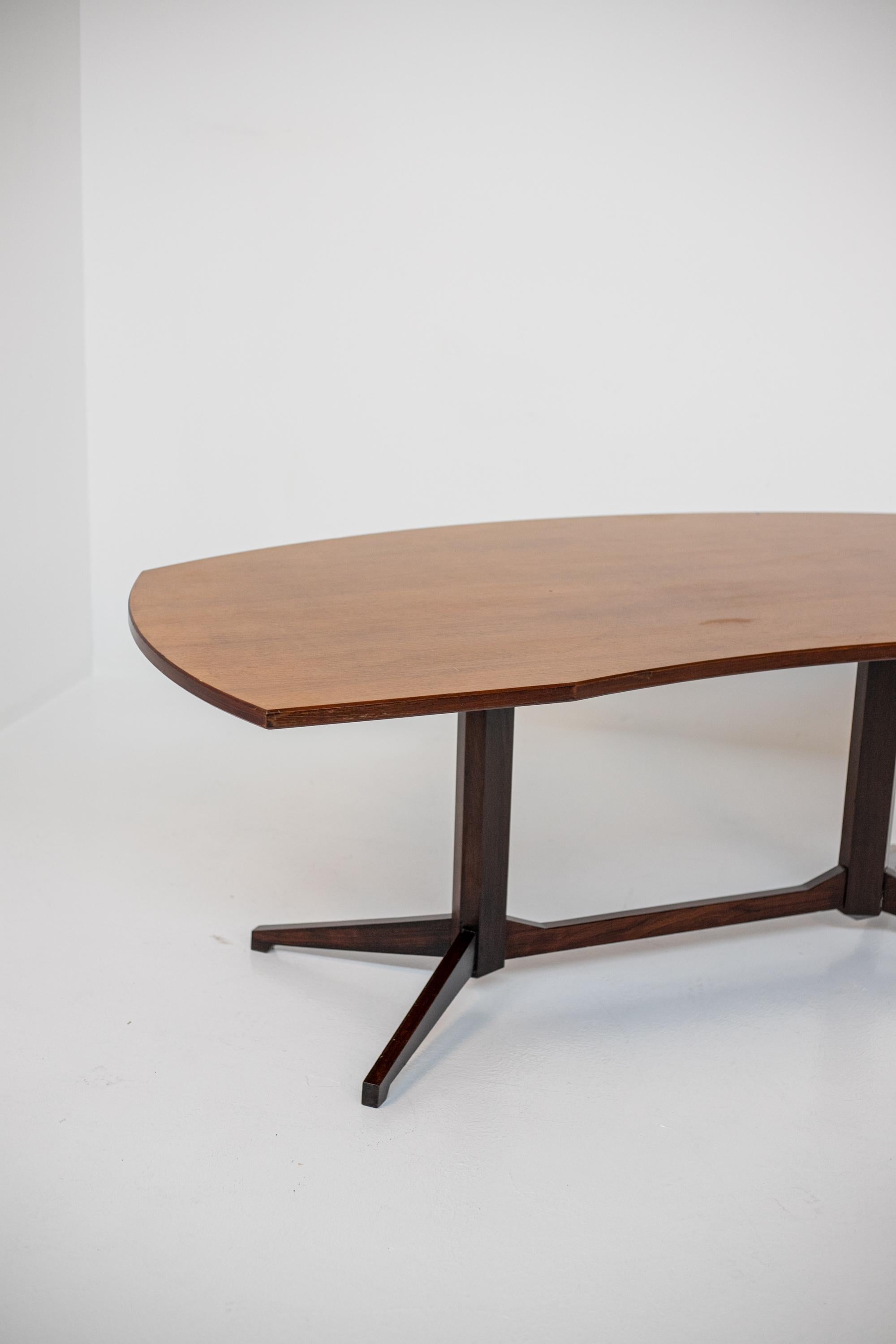 Rare table made by Franco Albini for the Poggi manufactory in the 1950s. 
The table is totally made of wood. The peculiarity of the table is its rectangular shaped top with one side shaped like a half moon. The legs are beautifully crafted in a