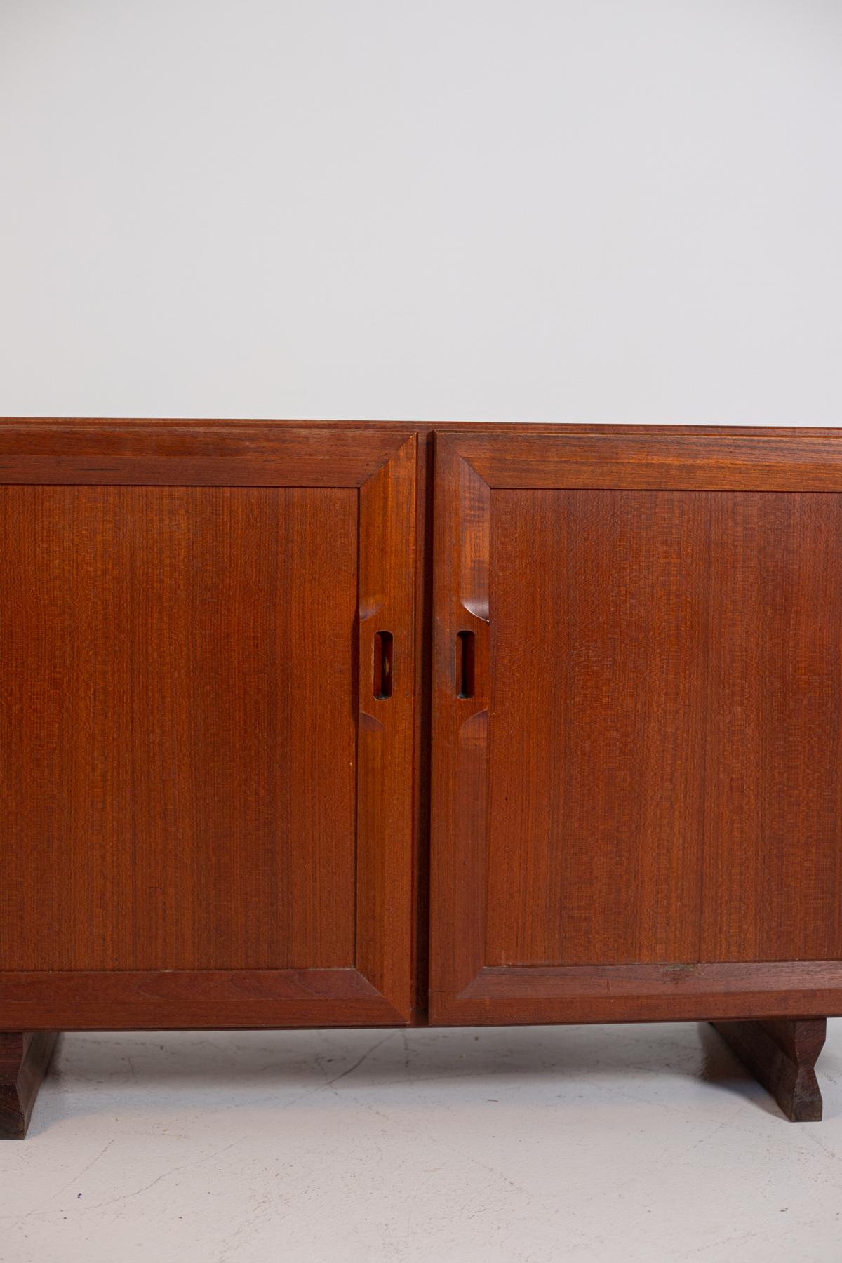 Pair of small walnut sideboards designed by Franco Albini in 1957 for the Poggi company. Model MB15, made entirely of wood, from the center because perfectly finished even on the back. The doors close with a magnet and have a wooden frame that