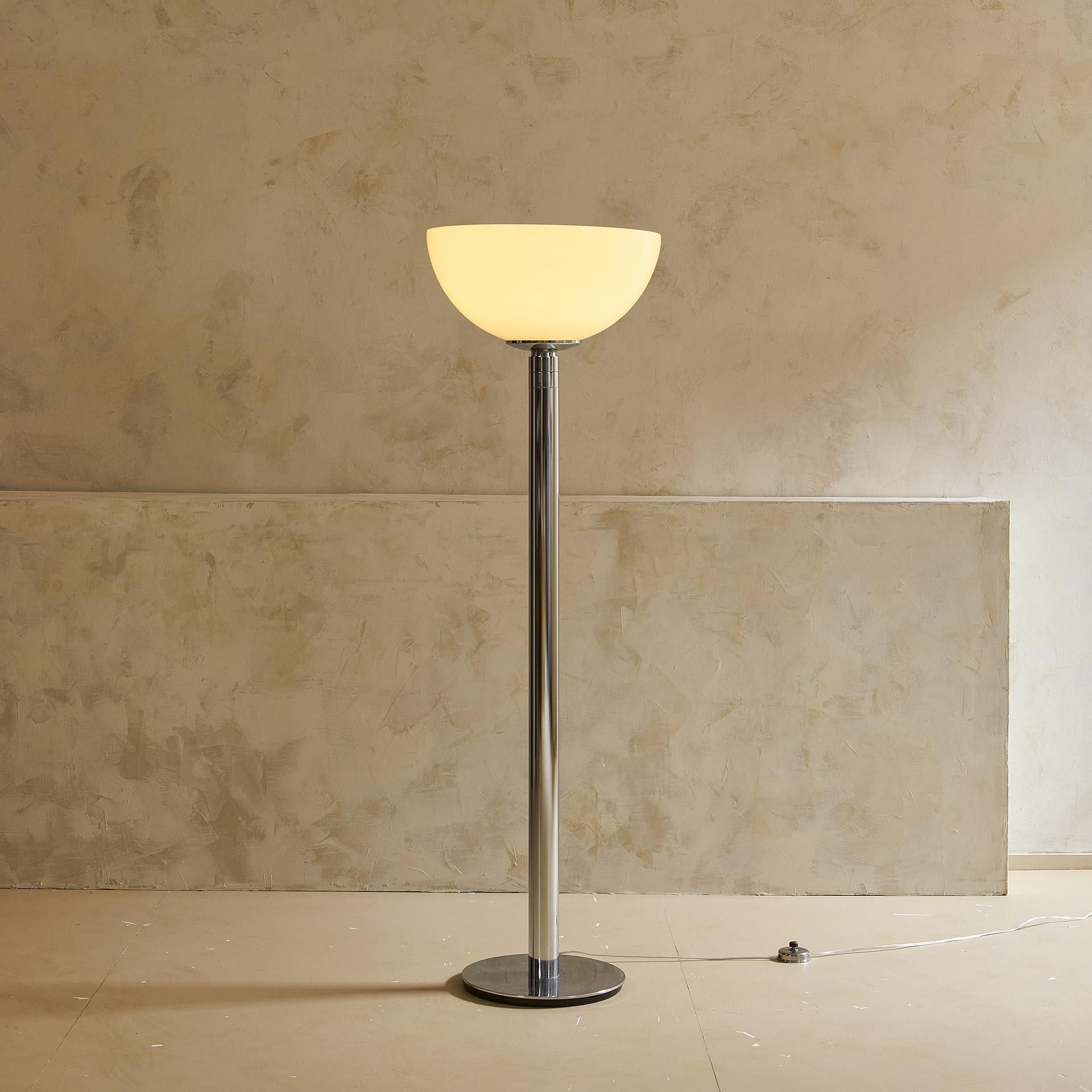 A handsome chrome floor lamp featuring a opaline rounded shade with a large opening, perfect for ambient lighting. Franco Albini & Franca Helg designed this for Sirrah in 1968.

Born near Milan in 1905, Franco Albini was an Italian architect,