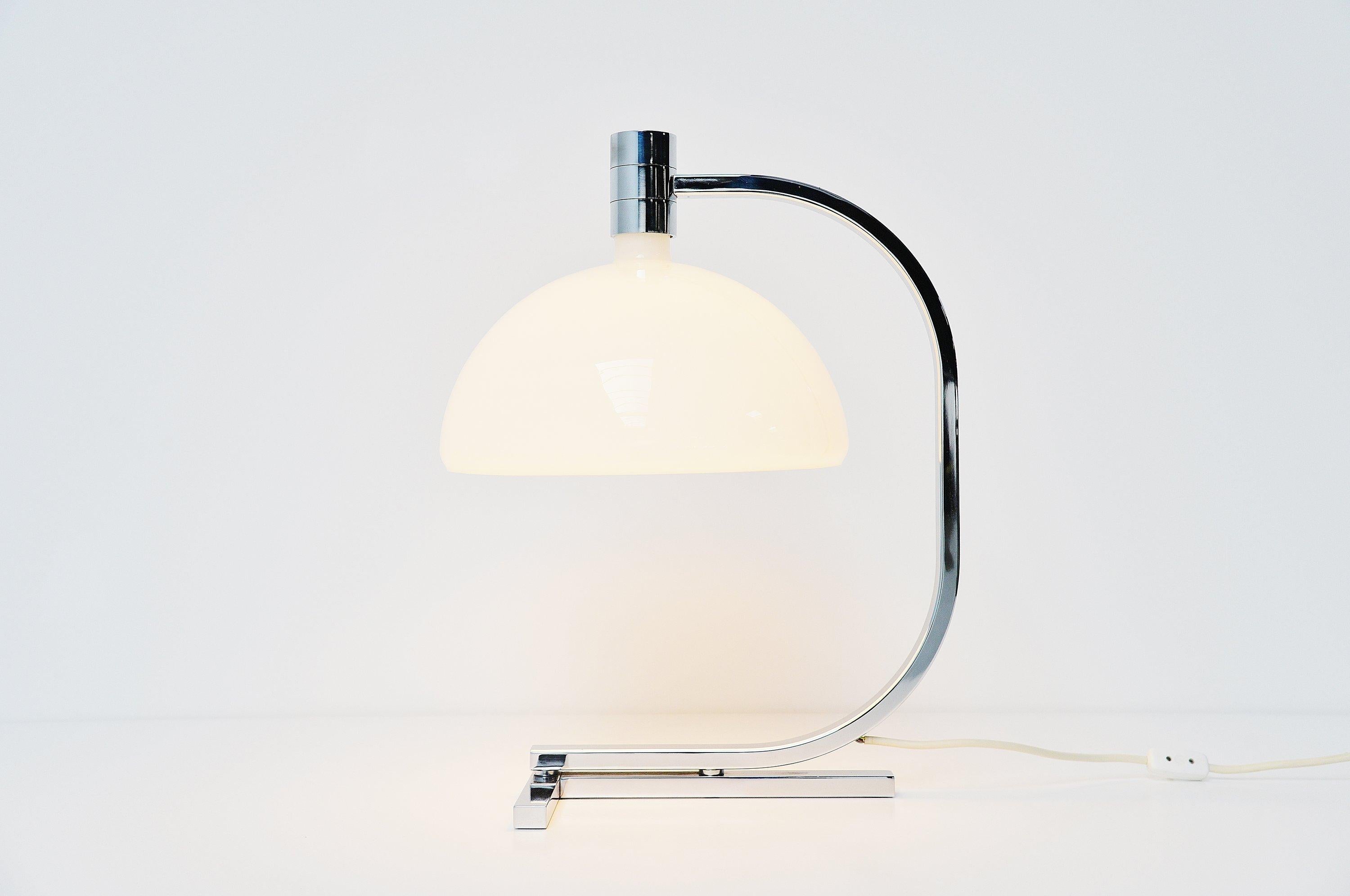 Table lamp model AS1C from the AM/AS series designed by Franco Albini and Franca Helg and manufactures by Sirrah, Italy, 1969. This large shaped table lamp has a chrome plated metal frame and a white glass opaline shade. The AM/AS series was a large