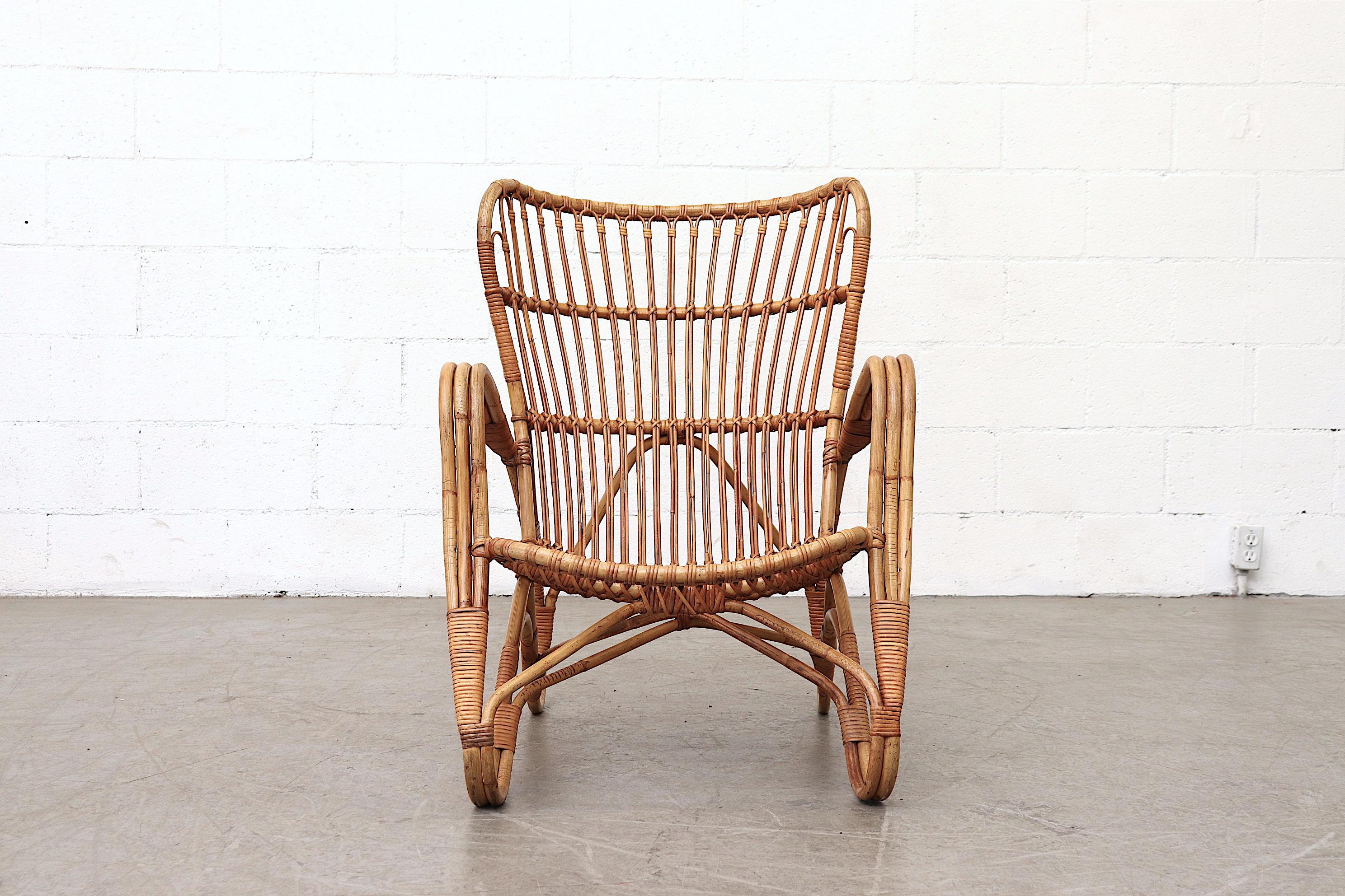 Gorgeous Franco Albini style high back bamboo lounge chair in good original condition with minimal bamboo loss. Light and sturdy. Visible wear consistent with age and use.