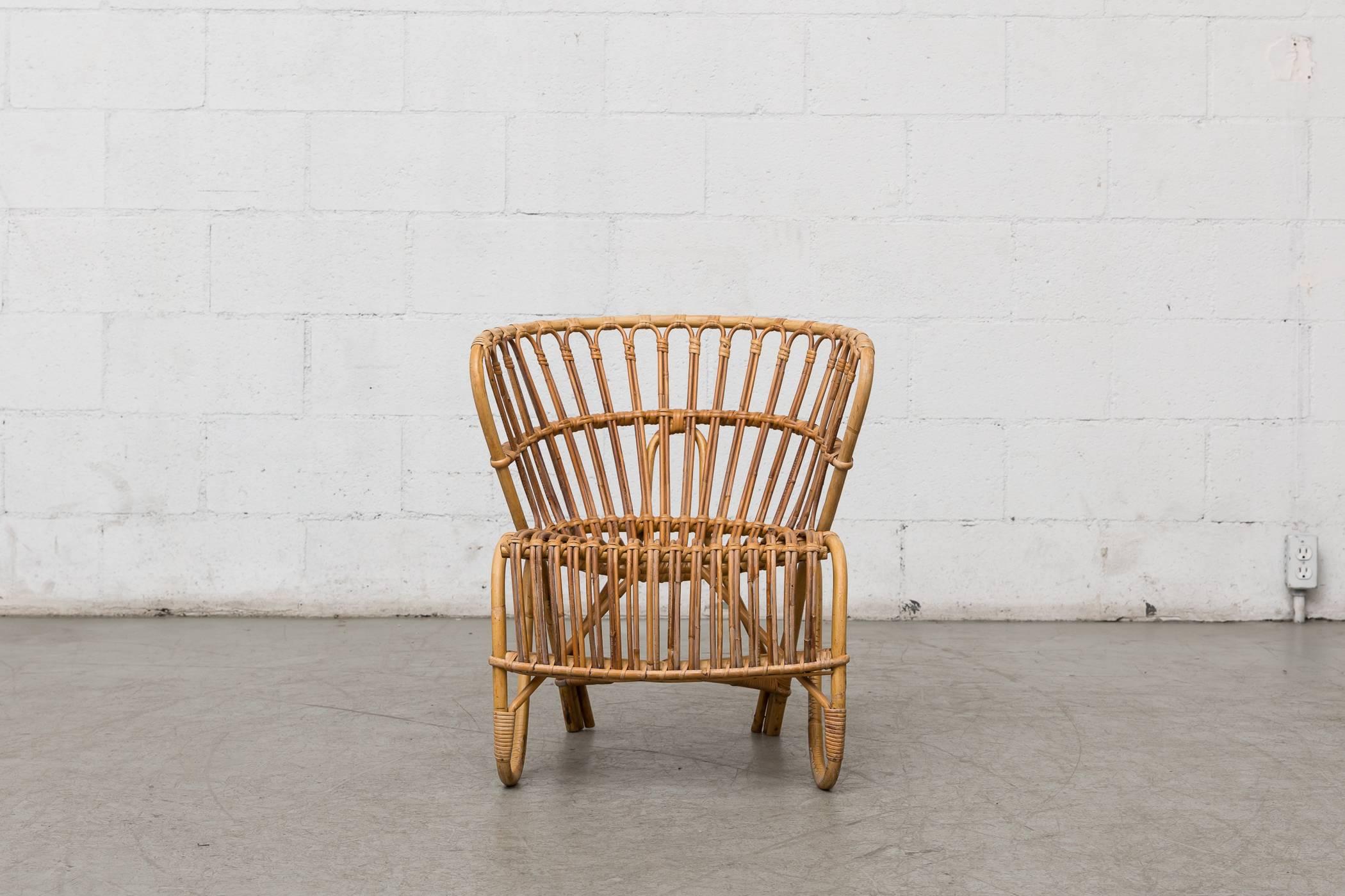 Midcentury natural bamboo lounge chair with minimal bamboo loss and breakage. Wear consistent with its age and usage.