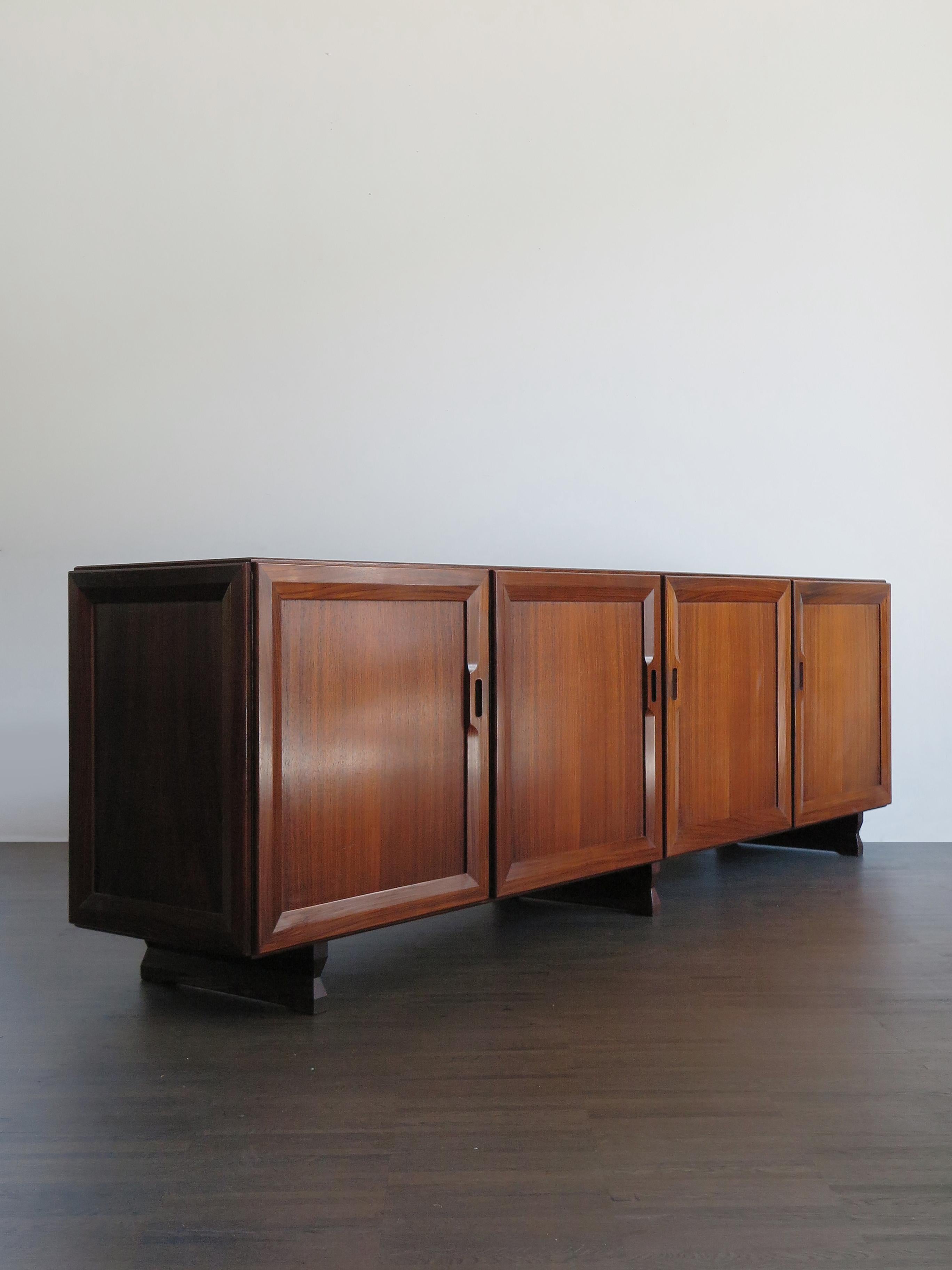 Italian rare and famous dark wood sideboard model MB15 designed by Franco Albini and produced by Poggi Pavia from 1950.
Wood veneer; feet, door frames and details in solid wood, 1950s

Bibliography:
G. Gramigna, Italian Design 1950 - 2000, Vol
