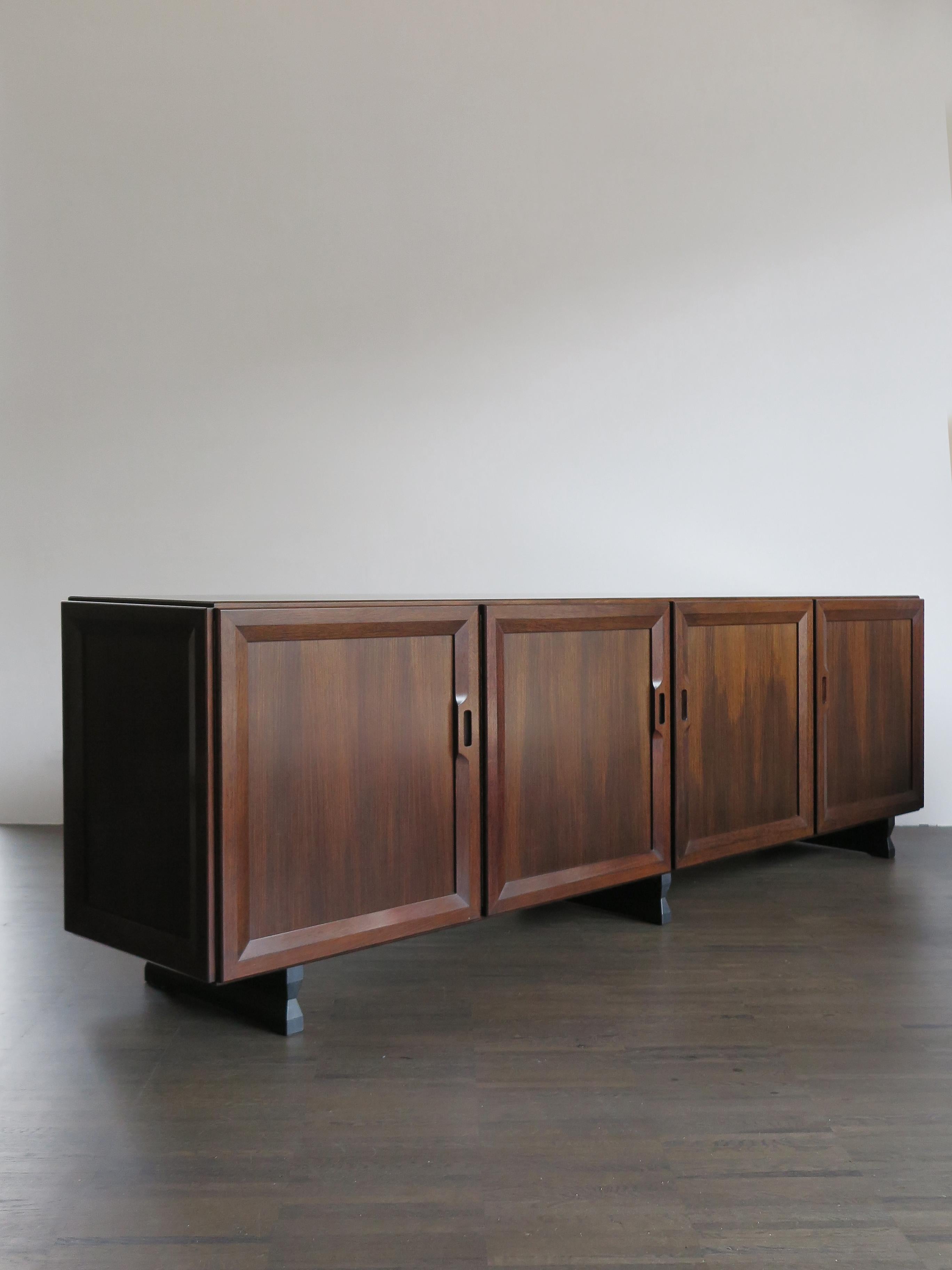 Italian rare and famous dark wood sideboard model MB15 designed by Franco Albini and produced by Poggi Pavia from 1950.
Wood veneer, feet, door frames and details in solid wood, 1950s

Bibliography:
G. Gramigna, Italian Design 1950 - 2000, Vol