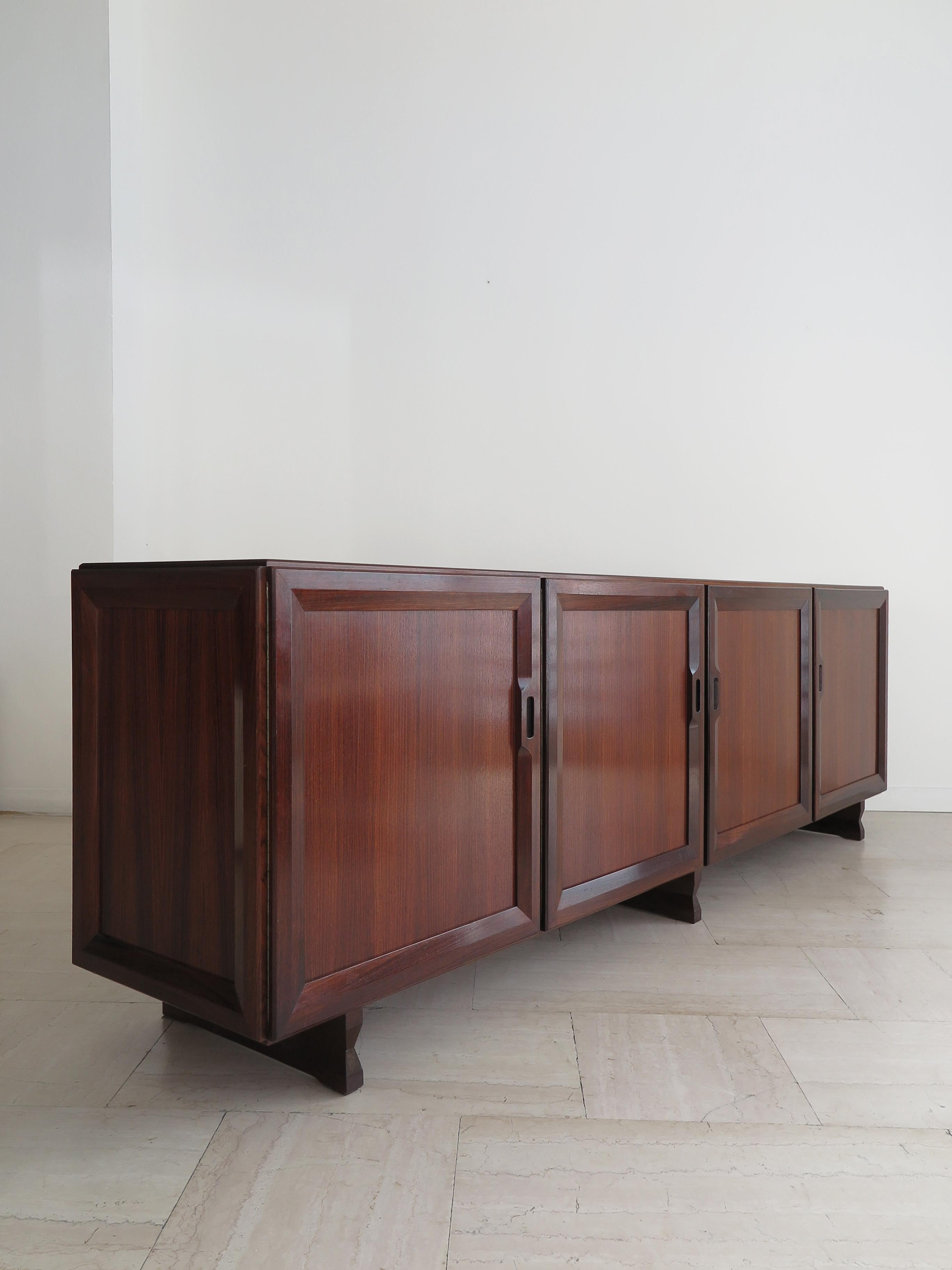 Italian Mid-Century Modern design credenza sideboard designed by Franco Albini and produced by Poggi Pavia from 1958, four doors with sliding shelves and a pull-out shelf / tray, solid dark wood, veneered and edged, Italy 1960s
Bibliography 
R.