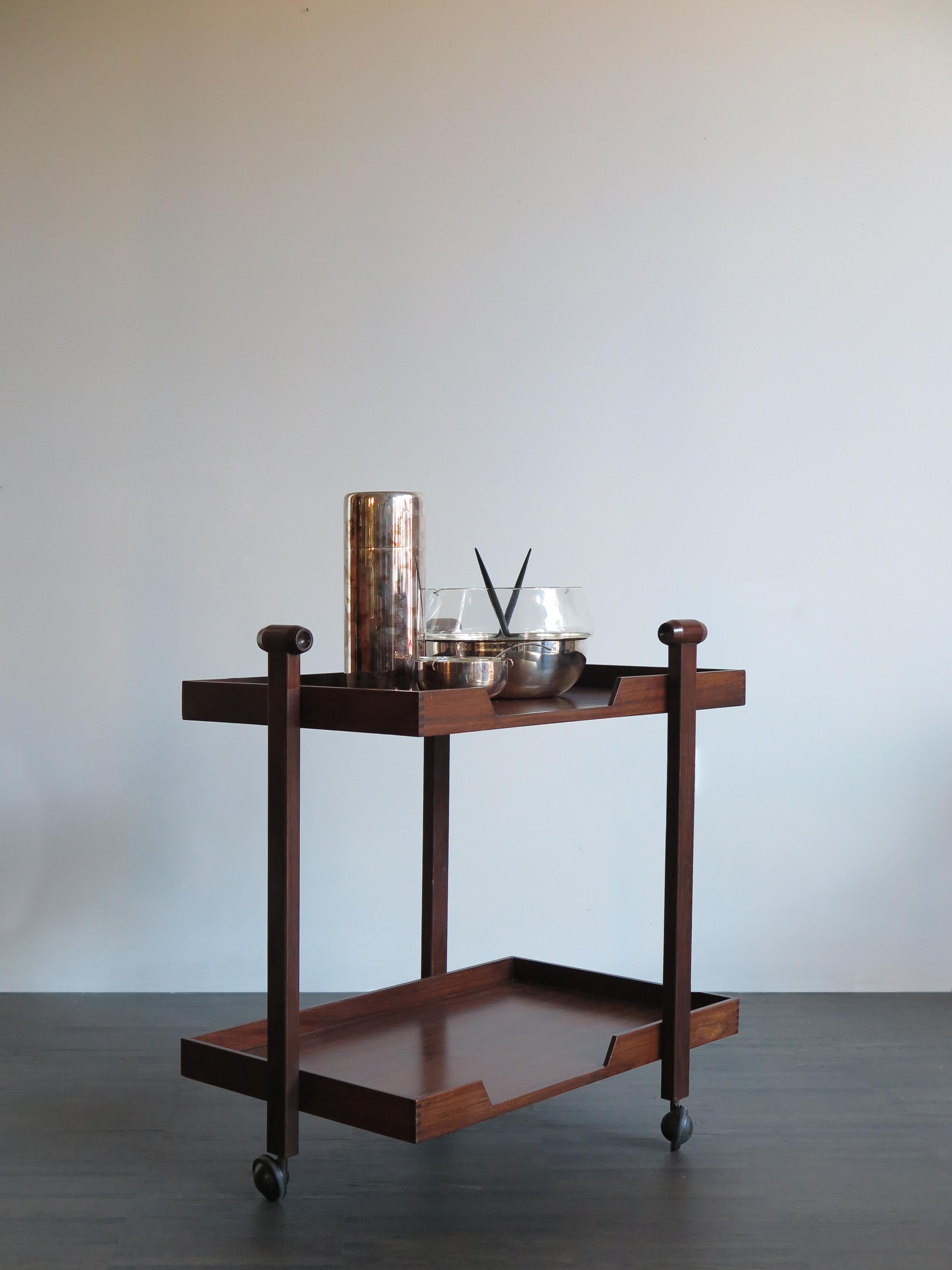 Very rare and fabulous dark wood serving trolley model CR20 designed by Franco Albini & Franca Helg and produced by Poggi from 1958.

Please note that the item is original of the period and thus shows normal signs of age and use.
