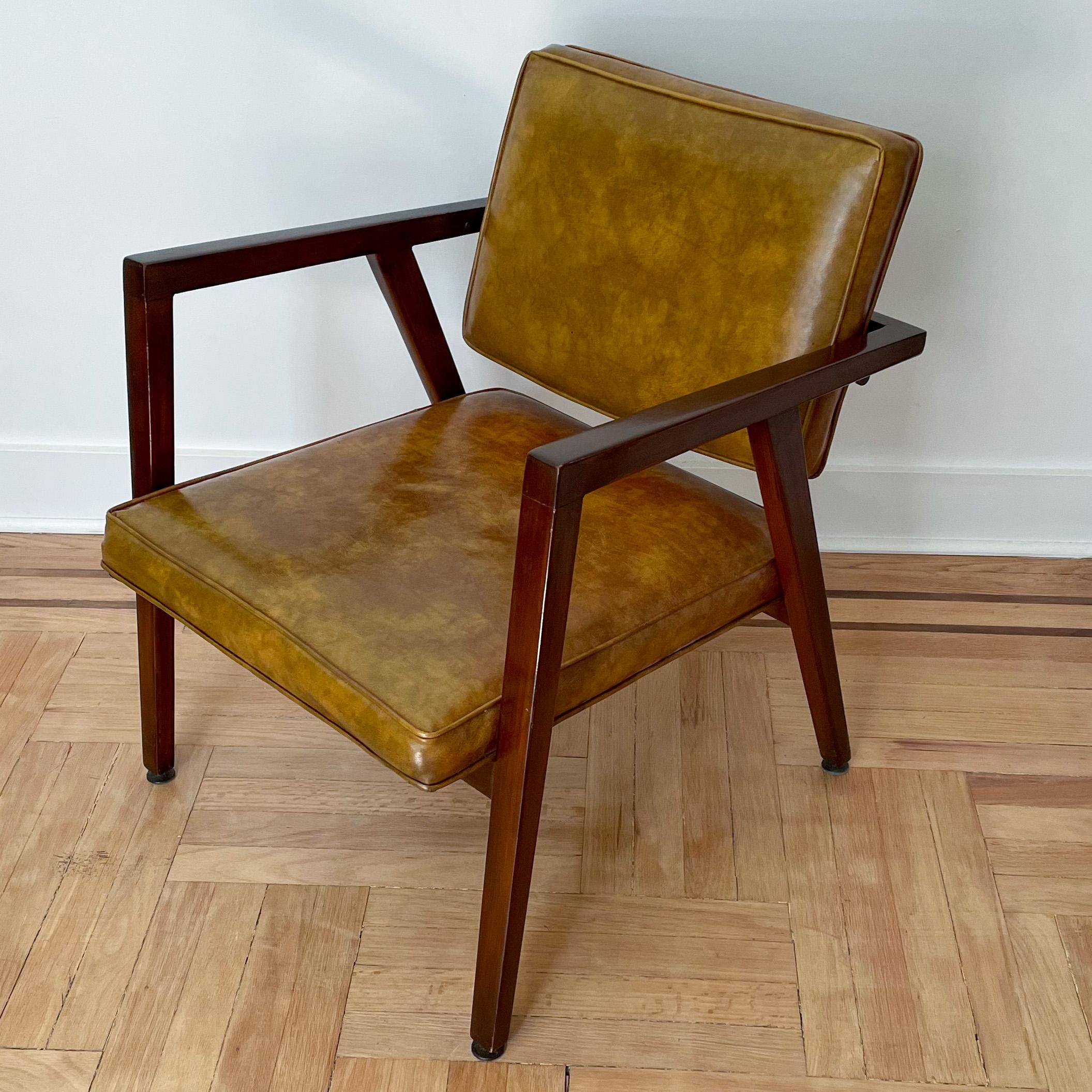 Lounge chair, model 49, designed by Franco Albini and produced by Knoll from 1949 until about 1967. This example circa 1950’s. Slender walnut frame with distinctive wrap-around arms, offset and angled rear legs, and steel fasteners. The