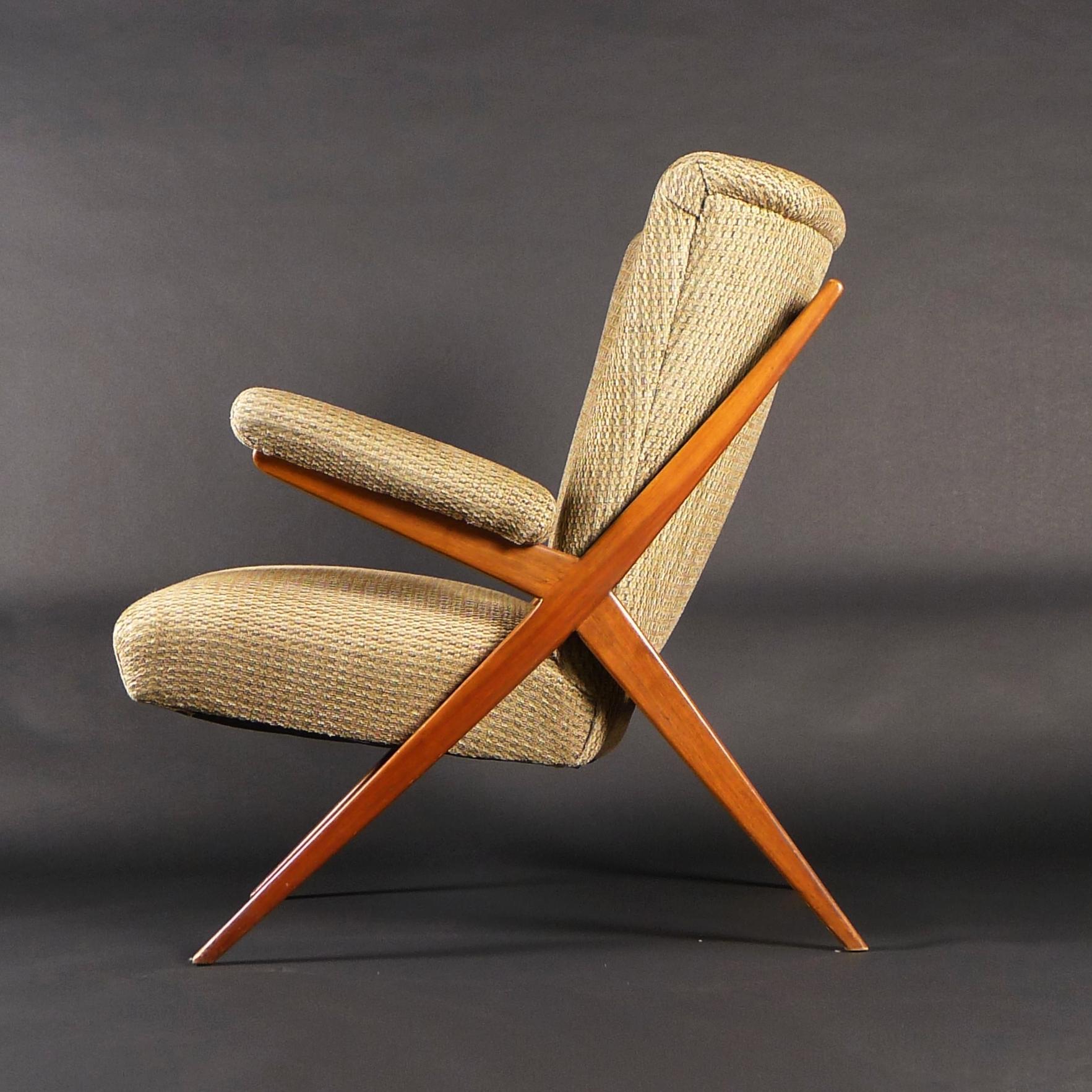 Franco Albini for Cassina, Lounge Chair, model CA832
with Italian walnut X frame and upholstered seat, back and arms with buttons to the curved back
89cm high, 69cm wide, 85cm deep, seat height 44cm

Literature: Repertorio 1950-1980, Gramigna, pg. 54