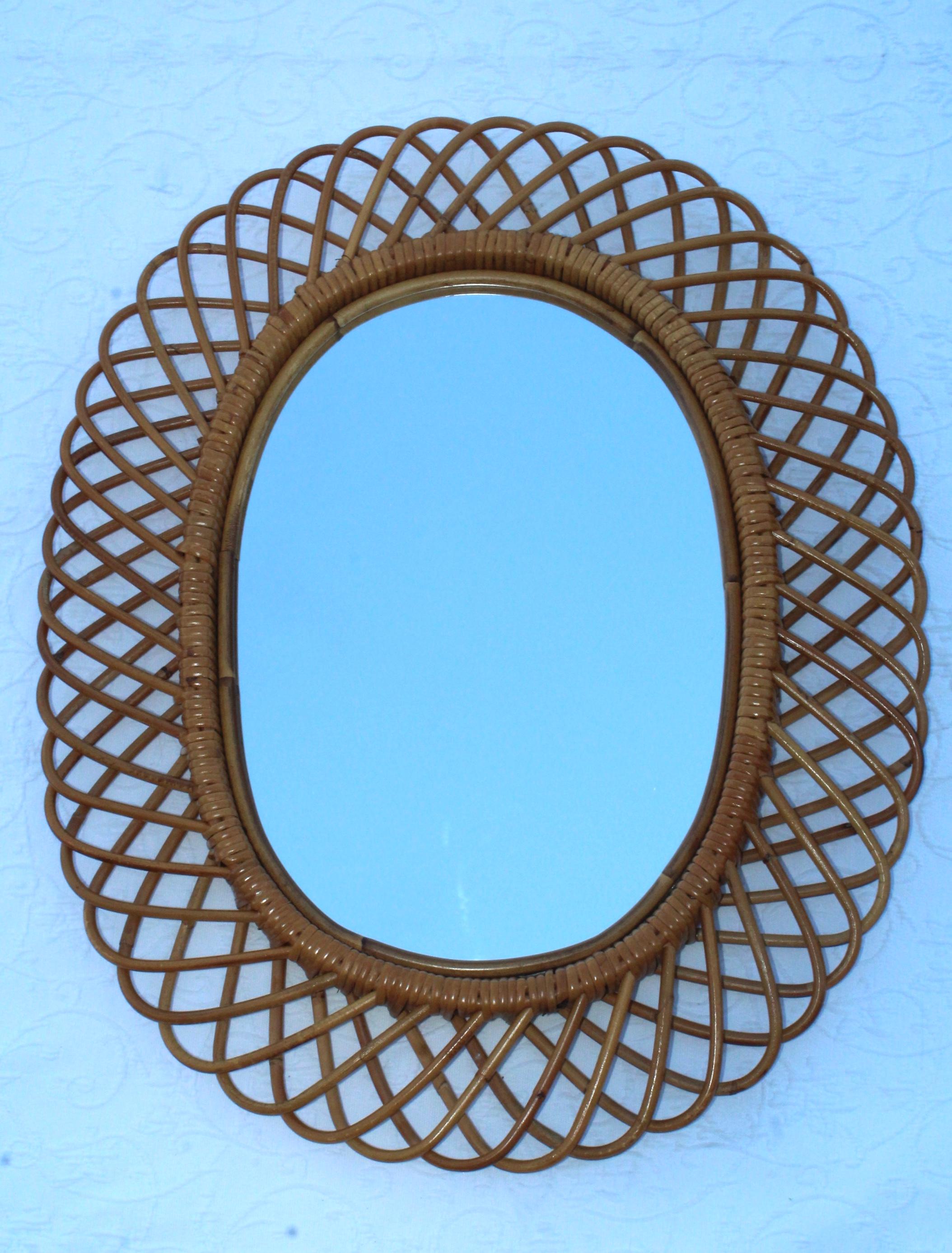 1960s Mid-Century Modern rattan and bamboo oval wall mirror designed by Franco Albini.