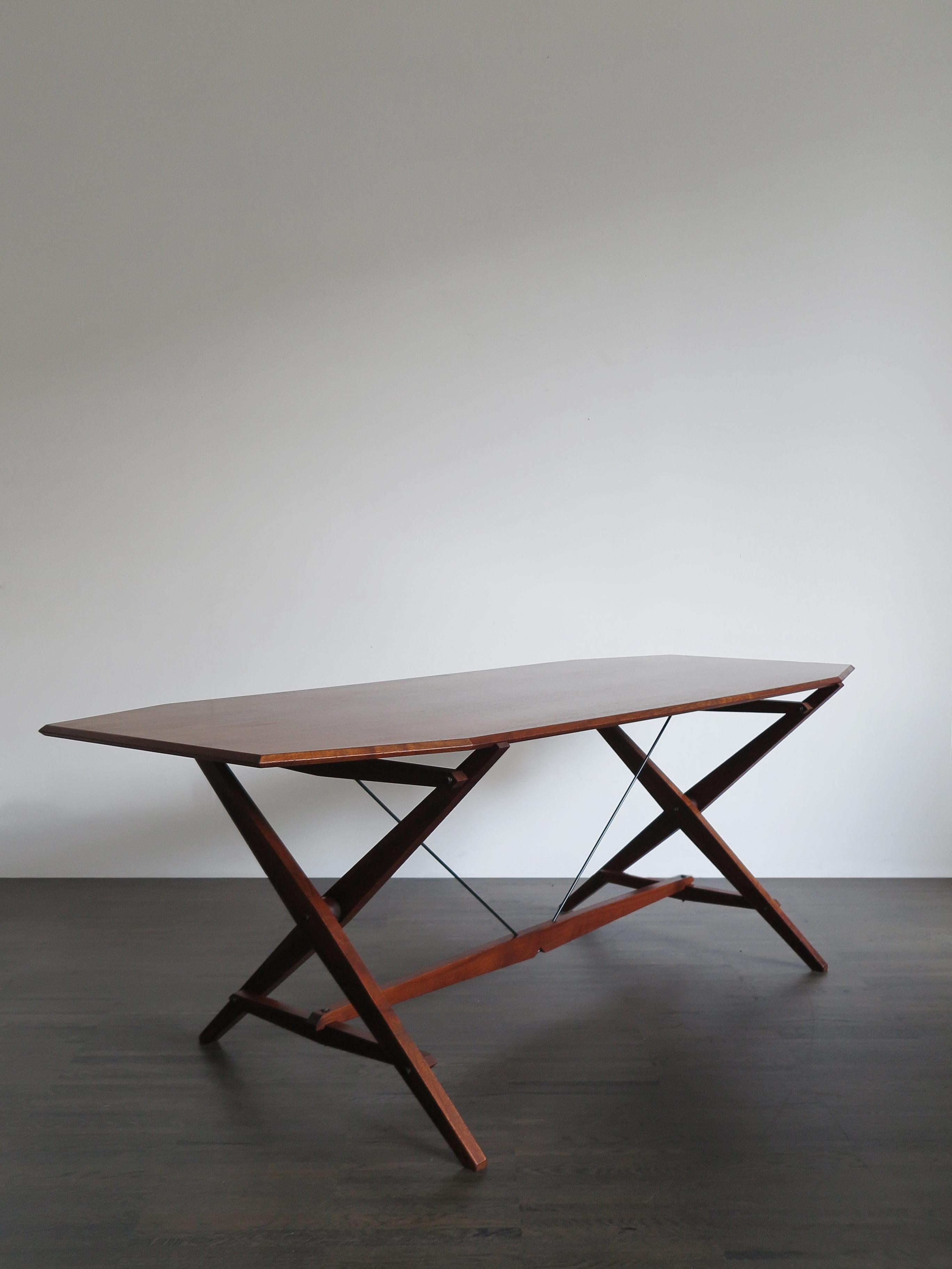 Italian midcentury modern design trestle table model TL2 designed by Franco Albini and manufactured by Poggi,
table designed according to structuralist criteria with solid wood trestle support, metal tie rods and wood veneered top, Italy