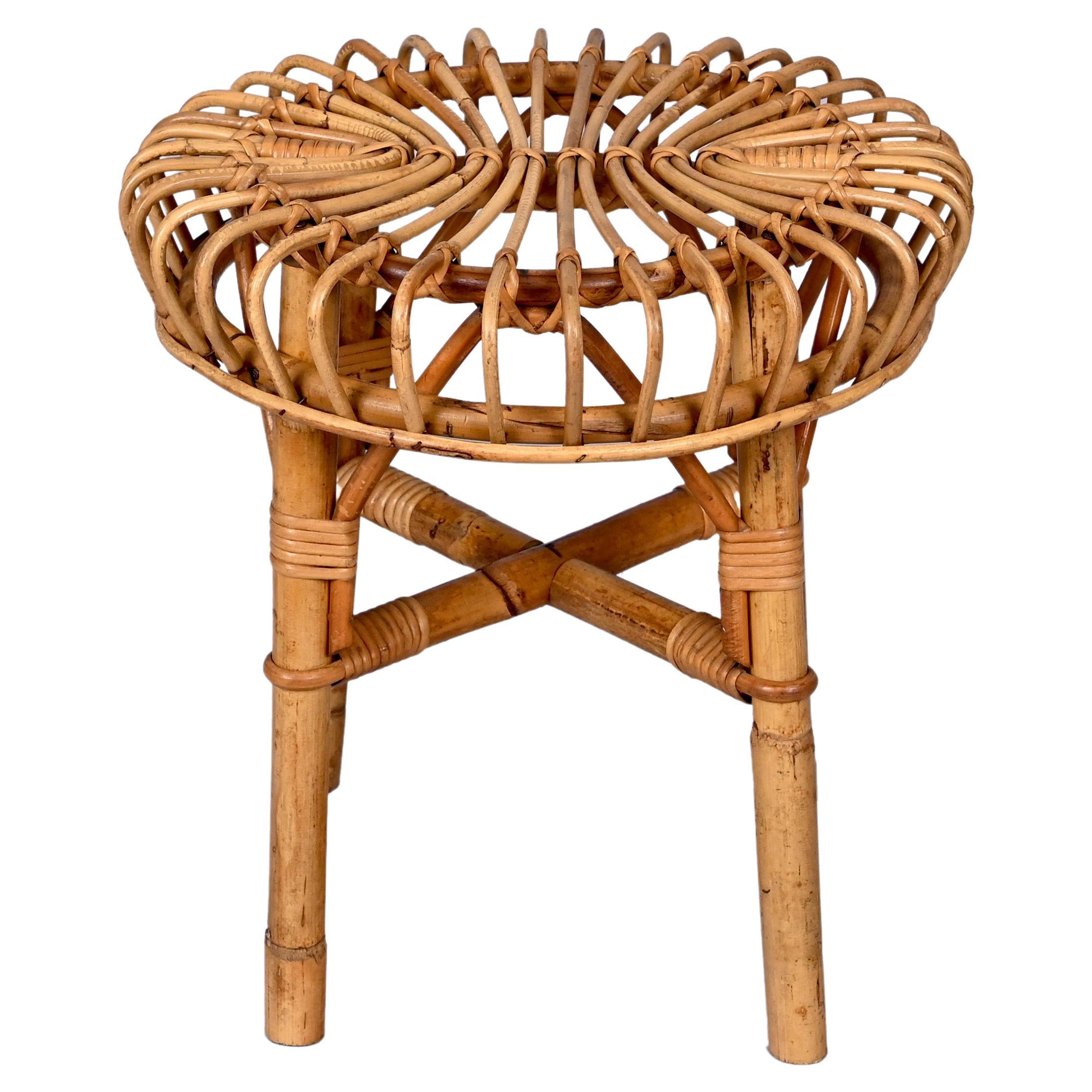 Mid century round bamboo & wicker ottoman stool. This pouf was designed by Franco Albini in Italy in the 1960s.

Franco Albini's extraordinary architectural ideas emerge in their purity and poetry of form, mixing form with fantastic