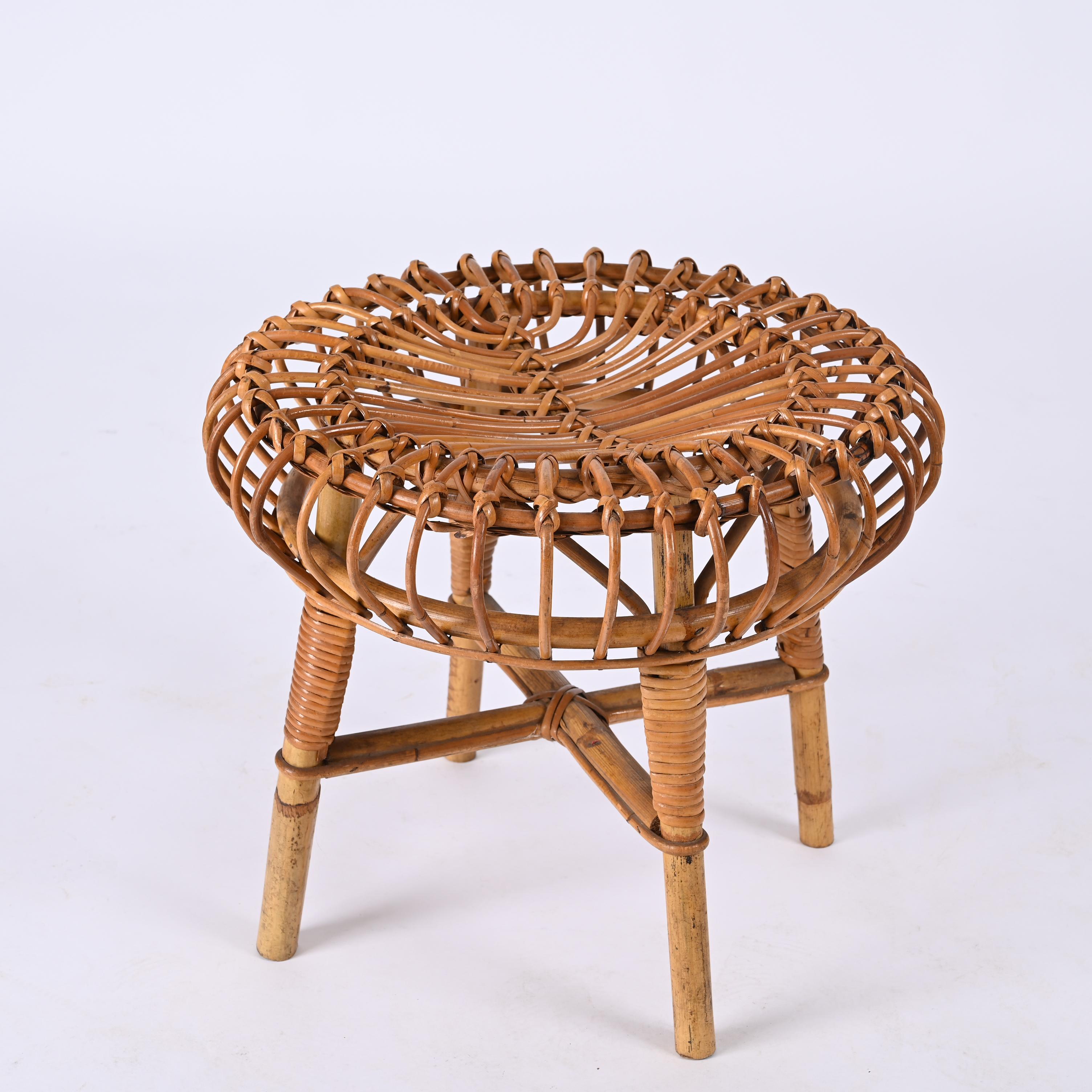 Midcentury round bamboo & wicker ottoman stool. Franco Albini designed this piece in Italy during the 1960s.

This item is iconic as Franco Albini's extraordinary architectural ideas emerge in their purity and poetry, mixing shapes with fantastic