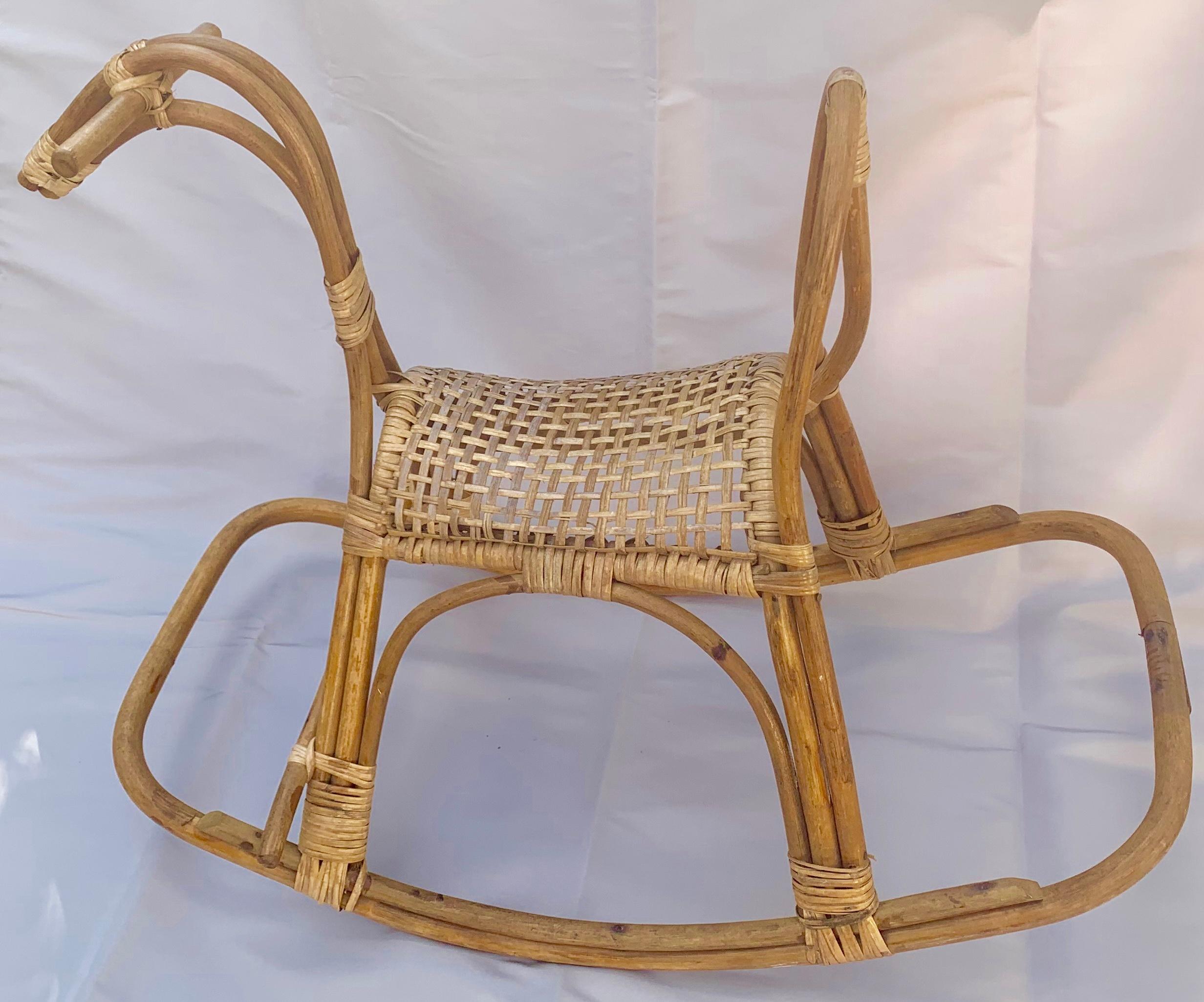 Franco Albini midcentury rocking horse sculpture. Midcentury rattan and wicker rocking horse sculpture, Italy, circa 1960.
Dimensions: H 24 in. x W 30 in. x D 18 in.