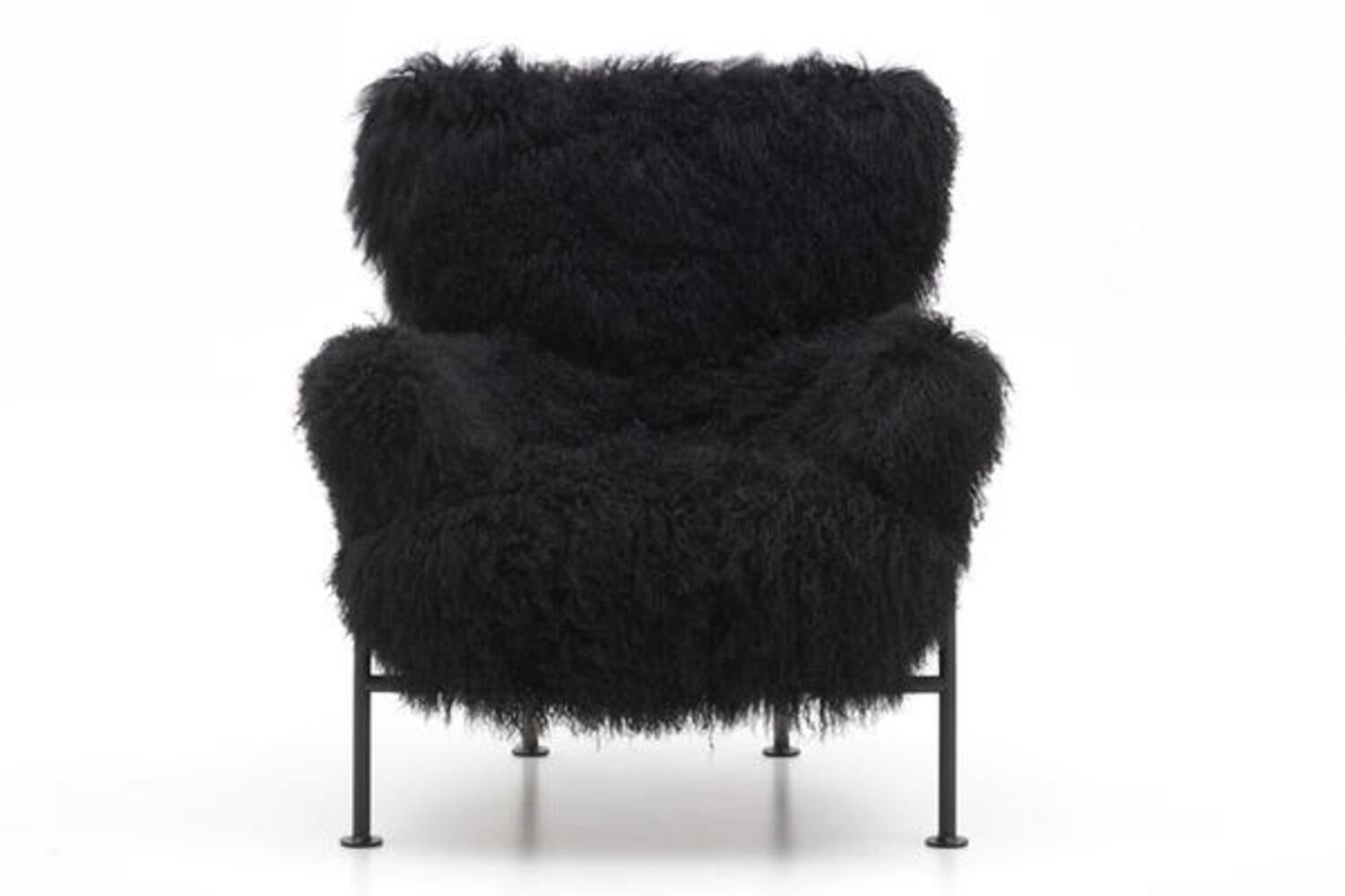 A beautiful PL19 (also know as Tre pezzi) armchairs with Enameled steel tube structure, upholstered in black Mongolian goat fur. 
Designed by Franco Albini & Franca Helg for Poggi, Pavia.
Late 1950s.