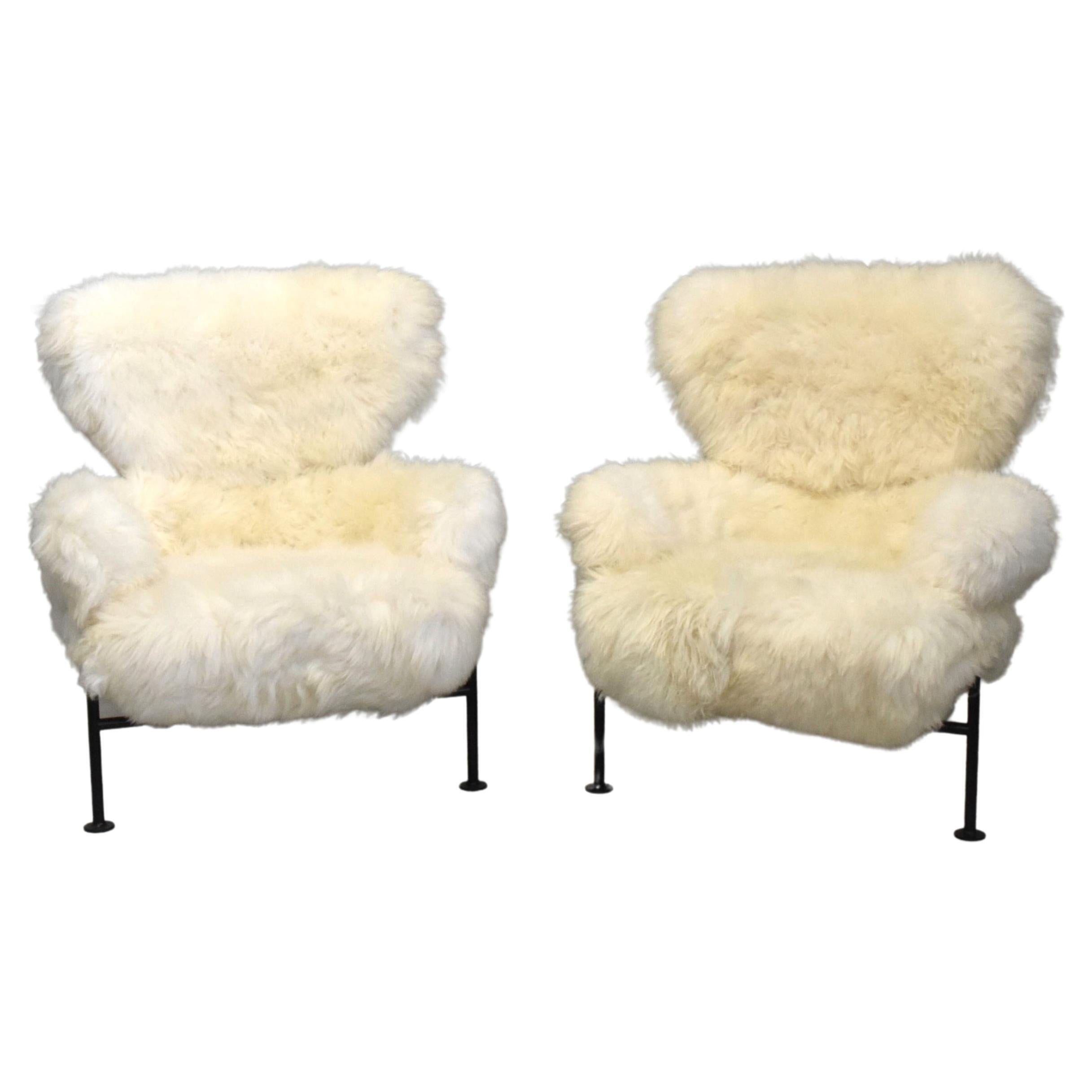 Armchair designed by Franco Albini (1905-1977) and Franca Helg Model n° PL19, 'Tre pezzi' 
Lacquered metal, brass and recently eupholstered in white sheep wool skin.
Early original models manufactured by Poggi in Italy around 1960.
Model created