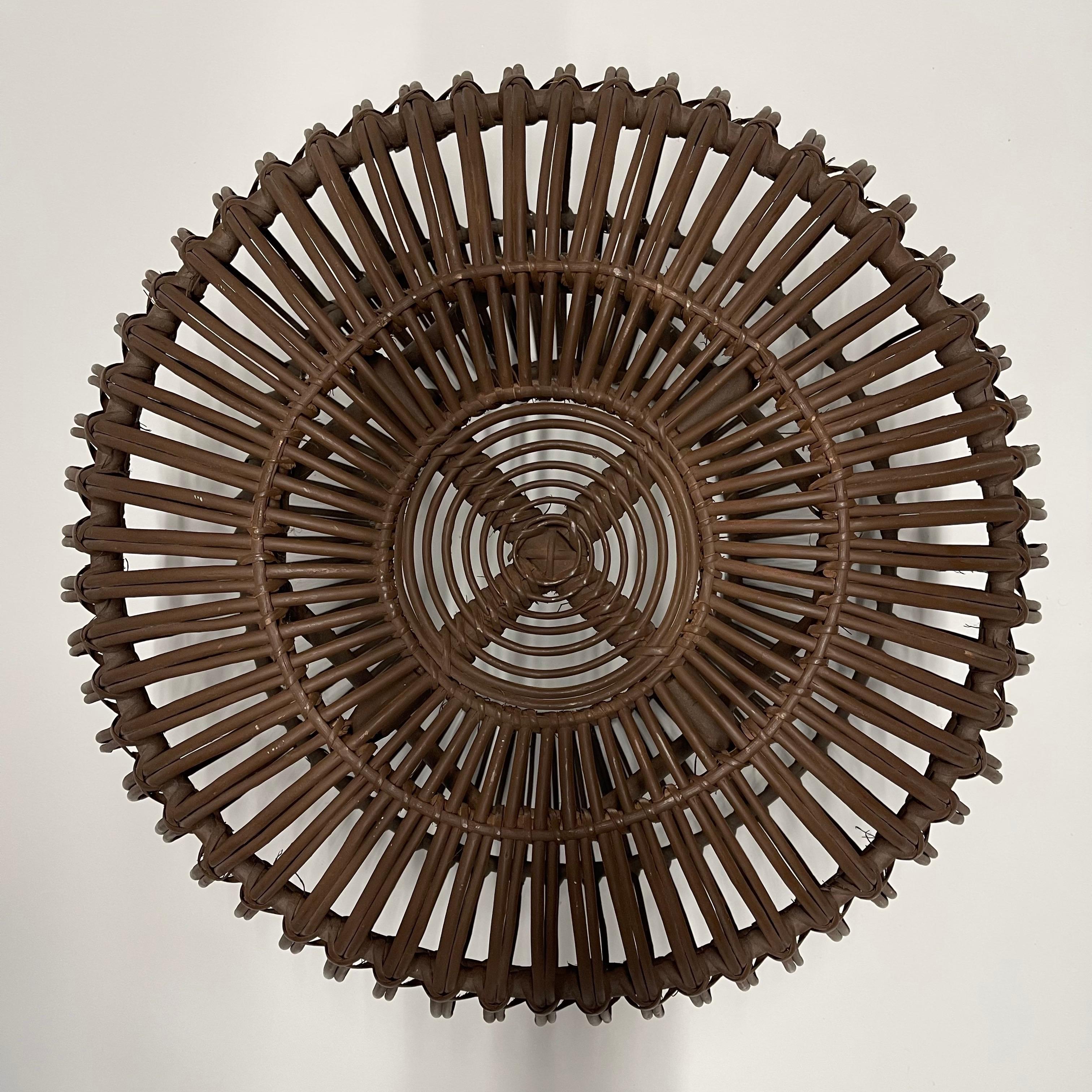 Mid-century Italian foot stool, ottoman, pouf, or hassock rendered in brown painted bent rattan bamboo reed in the style of Ico Parisi, circa 1960's.