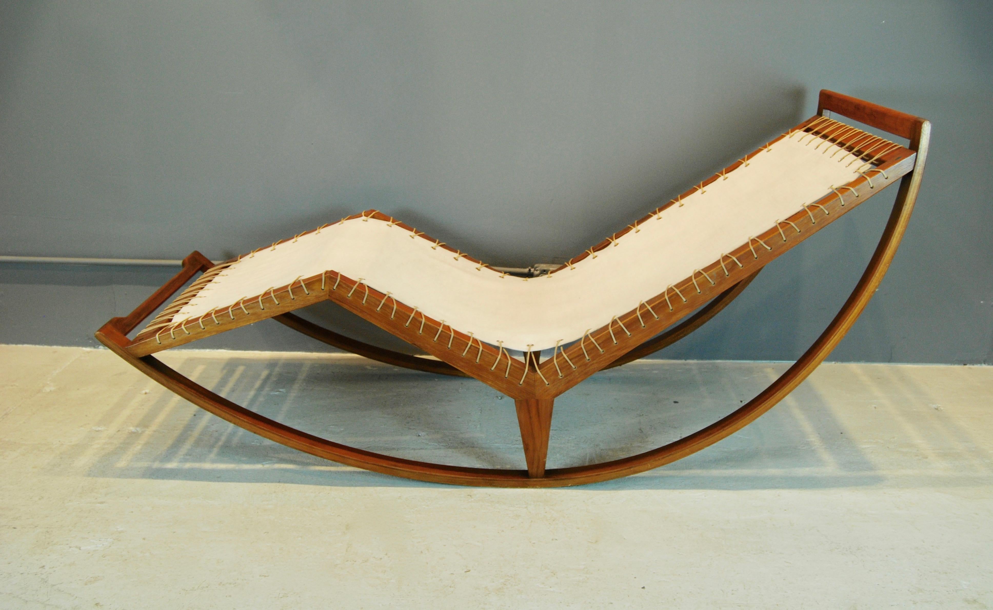 Franco Albini rocking chaise lounge, constructed of walnut, canvas and cord and manufactured by Poggi, Pavia, Italy, 1956. Chaise is in original condition with no damage or repairs.
Accompanied with a 