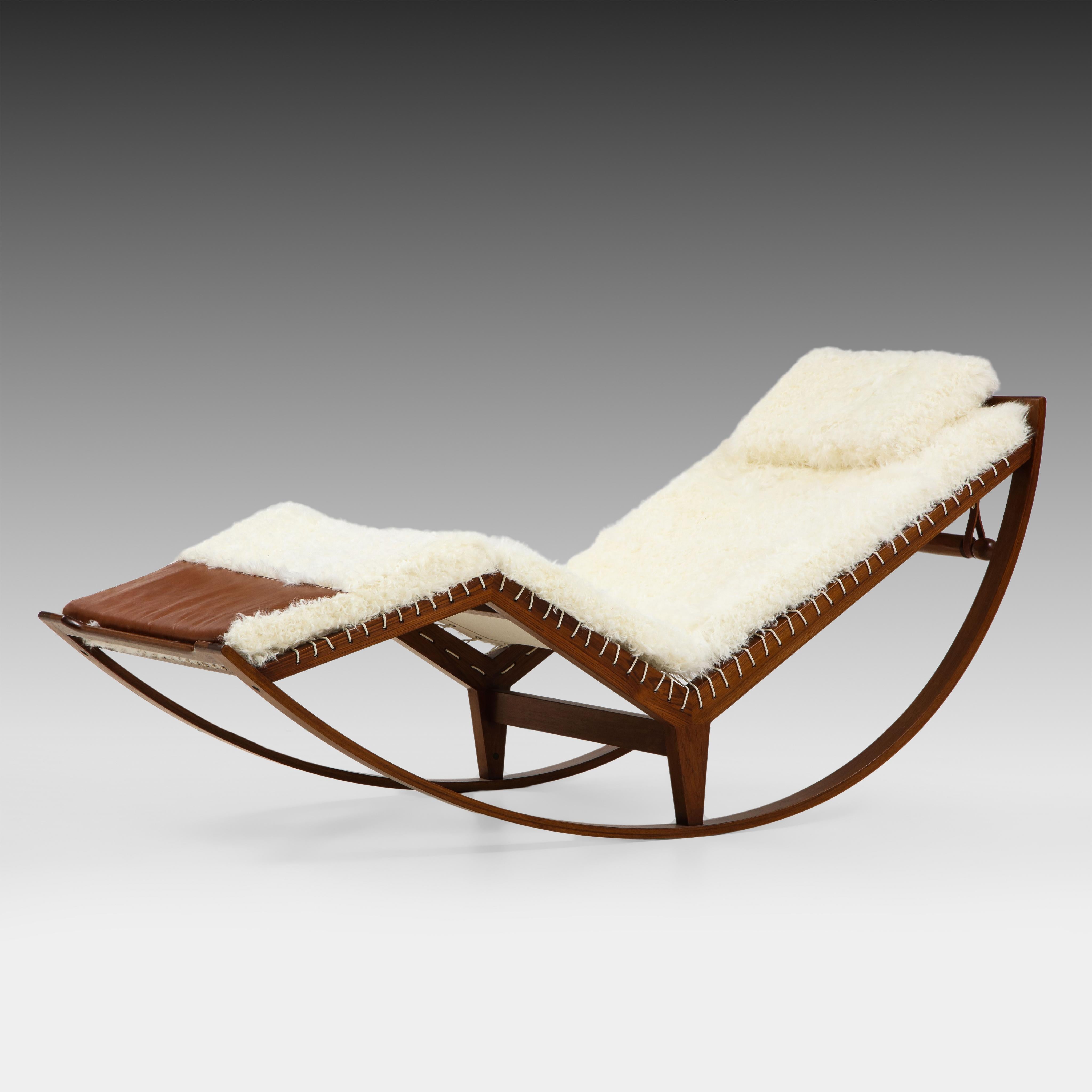 Franco Albini for Poggi rocking chair model PS16 with walnut frame and newly upholstered luxurious white Kalgan lambskin cushions with saddle leather details on canvas seating tied with rope.  This iconic chair was designed in 1956 by Franco Albini