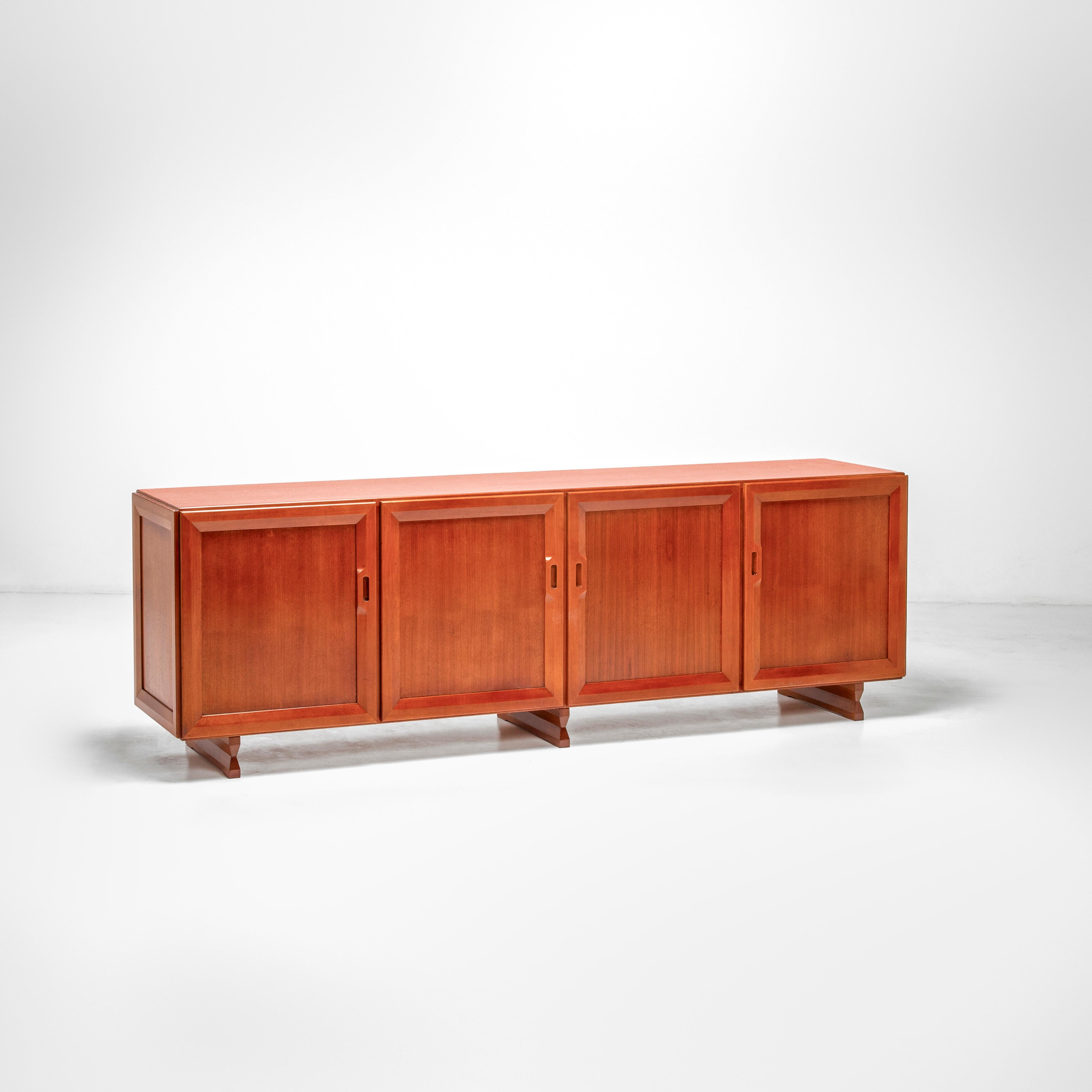 Modern sideboard by Franco Albini for Poggi - 1950s Italy. 
This design features a simplistic aesthetic with sharp lines. It has four compartments with doors. The sculptural legs give the sideboard an open and elegant appearance. The recessed