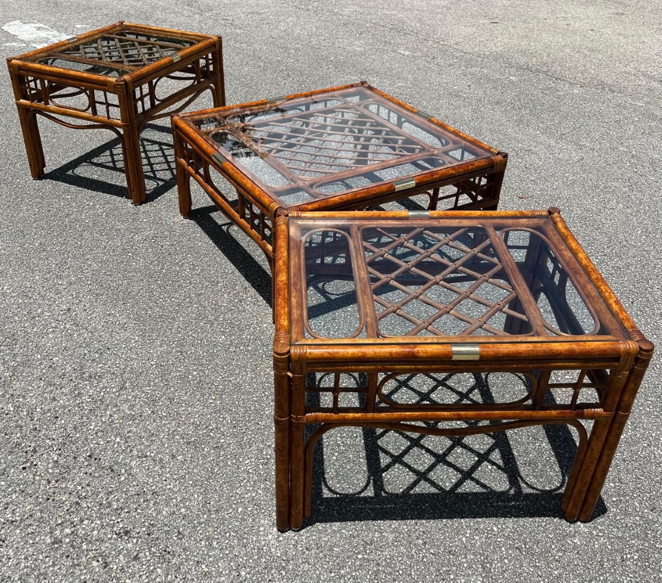 Franco Albini Style Bamboo Rattan Set of 3, Coffee and Side Tables

Stunning set of 3 bamboo rattan tables with glass tops (2 side tables and 1 coffee table). The 3 pieces feature a beautiful tortoiseshell burnt bamboo frame. Inspired by Franco