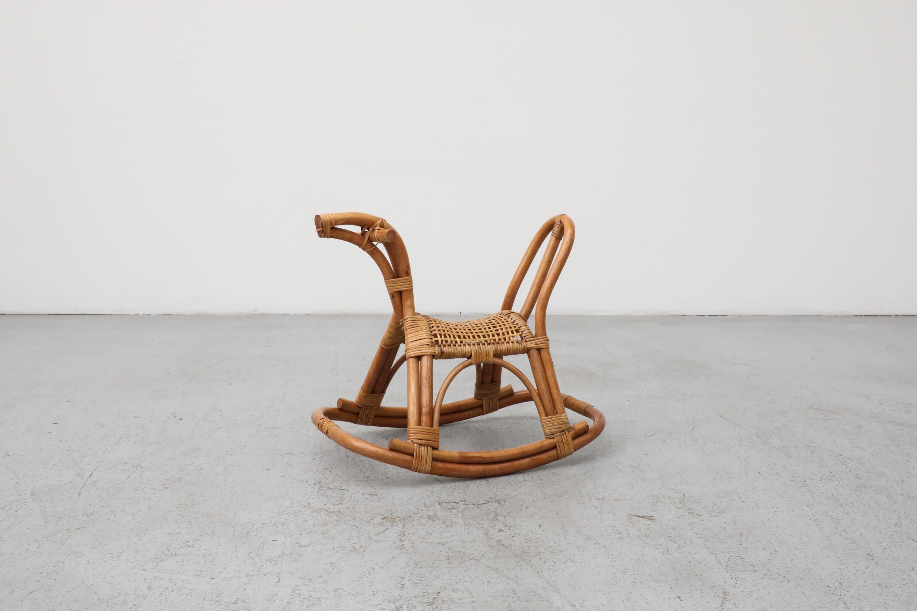A charming and exquisitely crafted Mid-Century style standing children's rocking horse, beautifully evoking the iconic natural material aesthetic of acclaimed Italian designer Franco Albini.

This piece showcases the distinctive use of bamboo, a