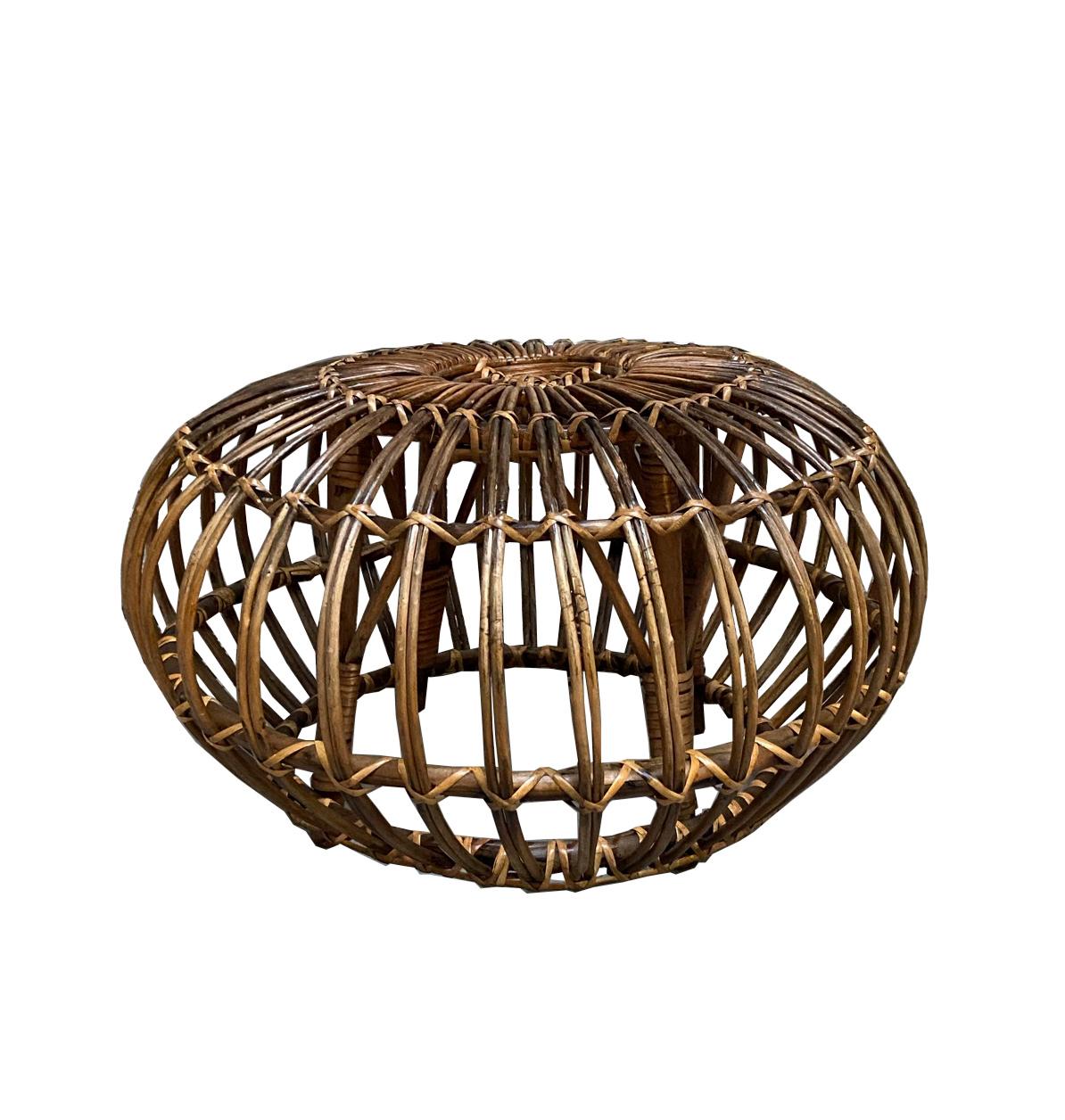 Round handwoven rattan, wicker ottoman, pouf, footstool or side table in the style of Franco Albini. 
Exemplary construction, woven ties are firmly linked.
An iconic design Classic made in Italy.