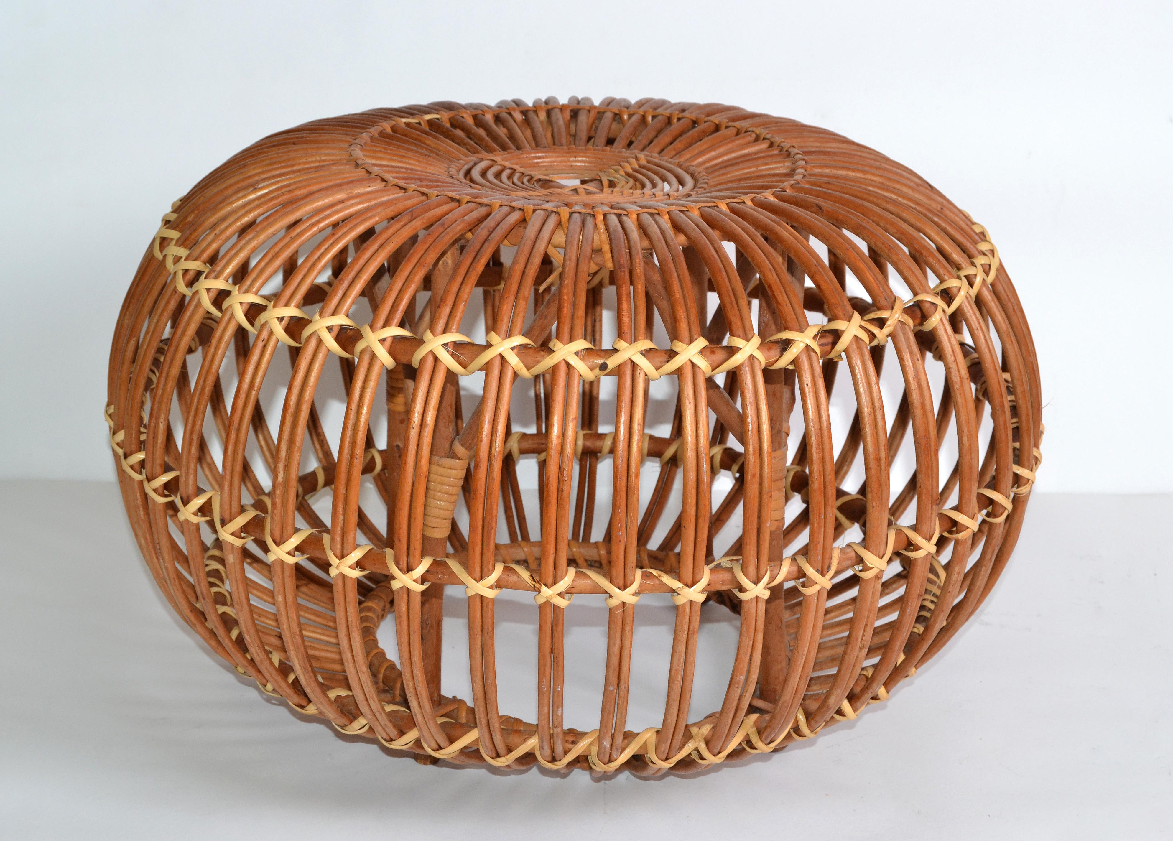 1960s vintage style of Franco Albini & Franca Helg round handwoven rattan, wicker ottoman, pouf, footstool or side table.
Exemplary construction, woven ties are firmly linked.
An iconic design Classic made in Italy.