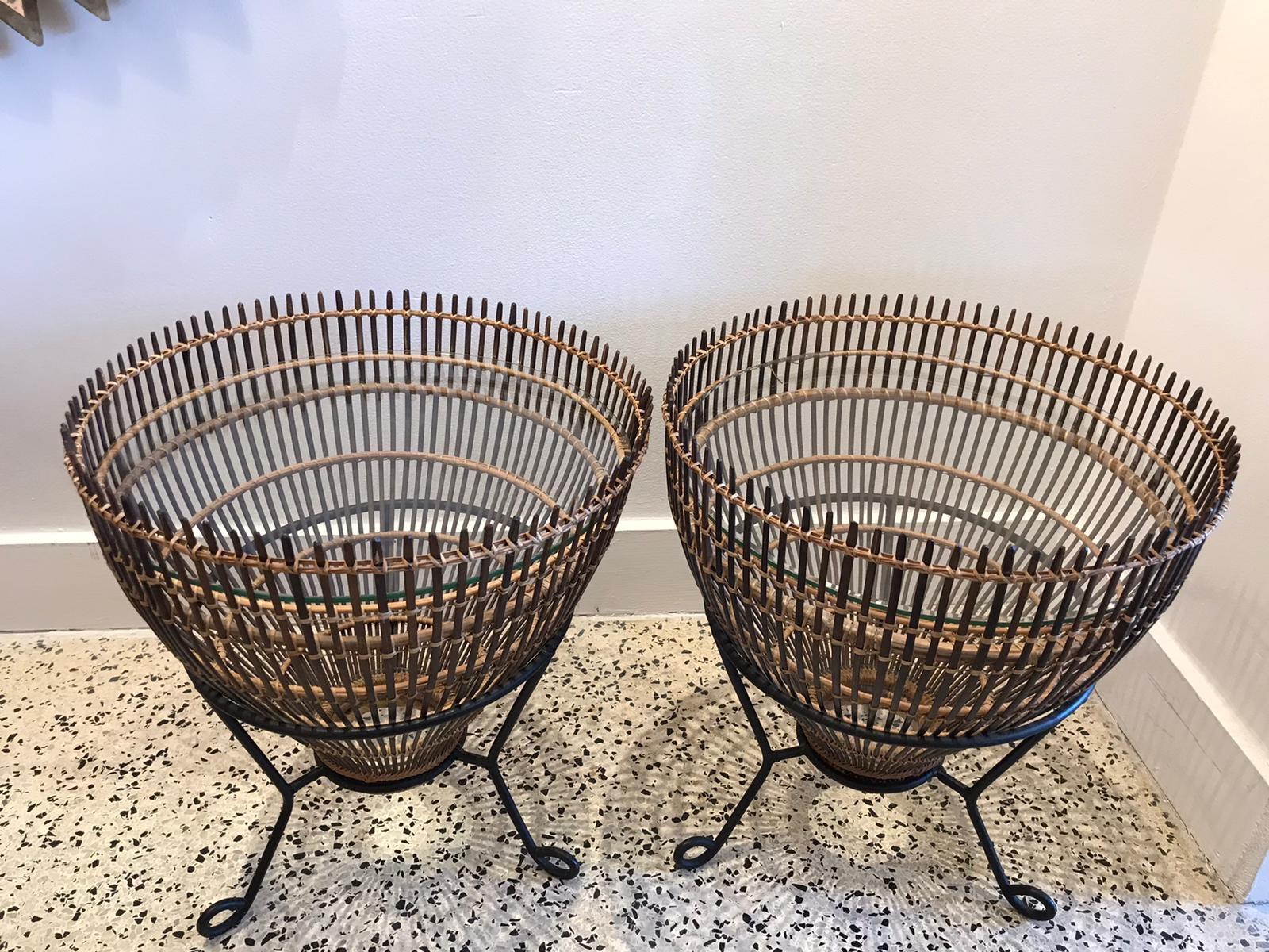 Midcentury pair of fishing basket side tables in the style of Franco Albini. Rattan Bamboo with round glass top and original metal bases.