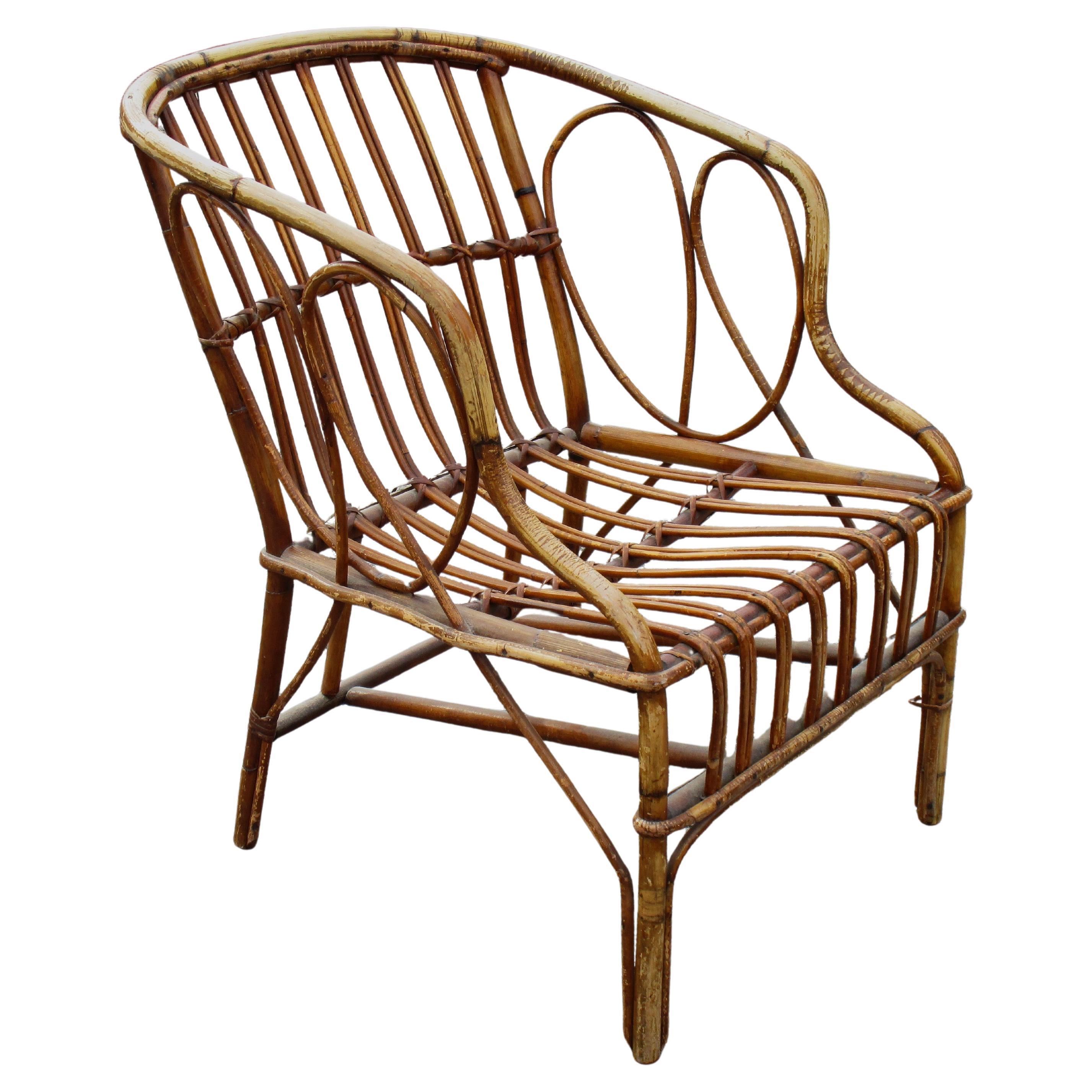 Poltrona in rattan e canna da zucchero in patina originale ben invecchiata. Nello stile di Franco Albini, circa 1950. Una sedia dall'aspetto fantastico. Misure  29 1/2
