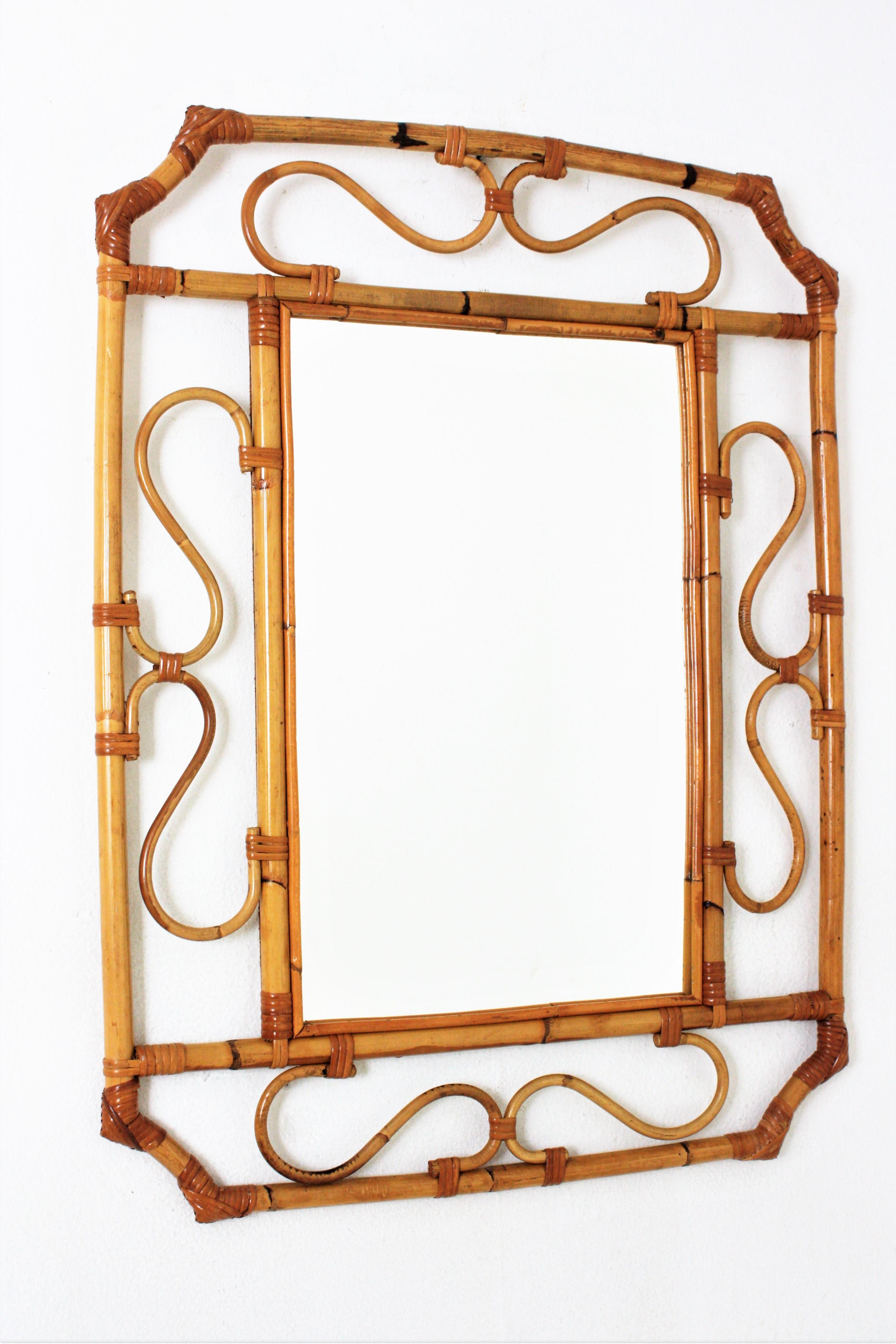 Rattan wall mirror, Franco Albini Style. Italy, 1960s.
An octagonal  frame with scrolled decorative details surrounding a rectangular central glass.
This piece has all the taste of the Italian Riviera and it is perfect to be placed alone or mixed
