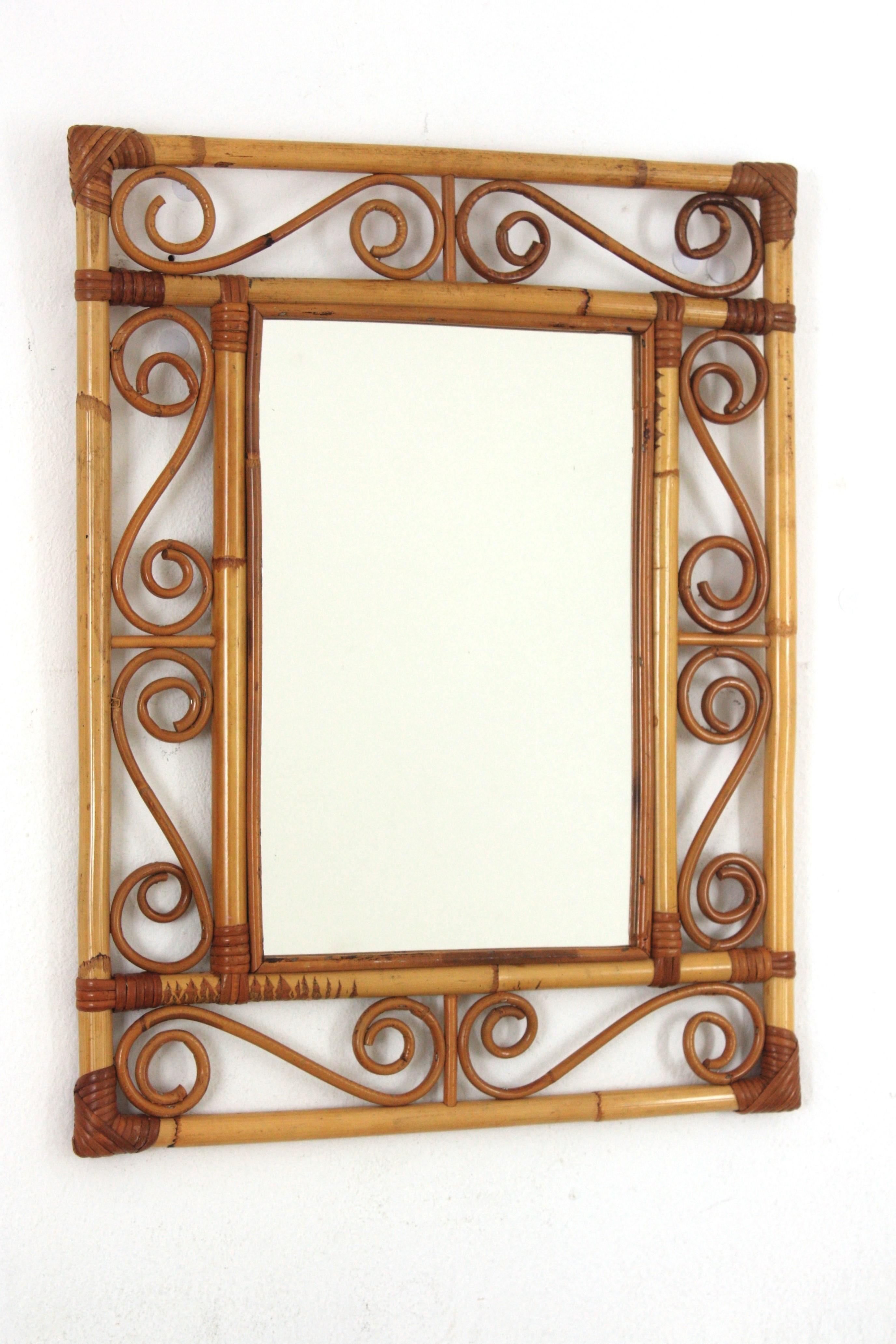 Rattan wall mirror, Franco Albini Style. Spain, 1960s.
A highly decorative handcrafted bamboo and rattan mirror with the taste of the Spanish Mediterranean Coast style. 
Handcrafted in the manner of Franco Albini. Excellent vintage