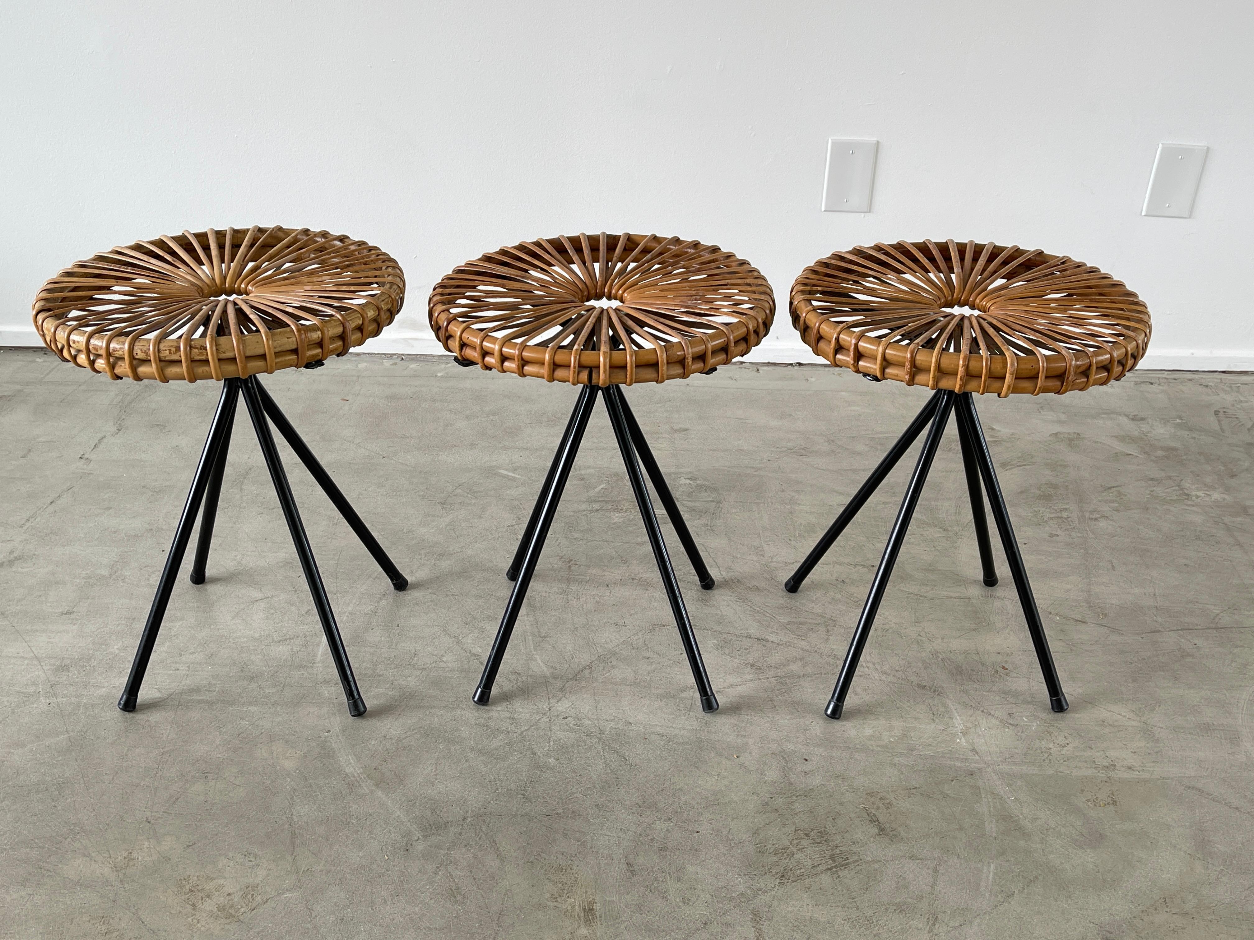 Great rattan and iron circular stools with iron base 
Priced individually.