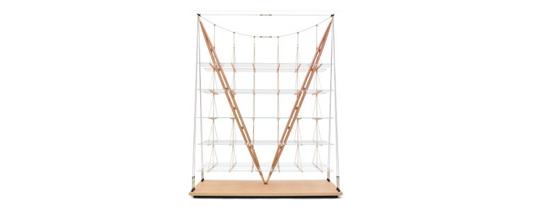 Bookcase designed by Franco Albini in 1940. Relaunched in 2011-19.
Manufactured by Cassina in Italy.

Defying the laws of physics, going beyond what we normally understand by the conditions of equilibrium, this bookcase is nothing short of a
