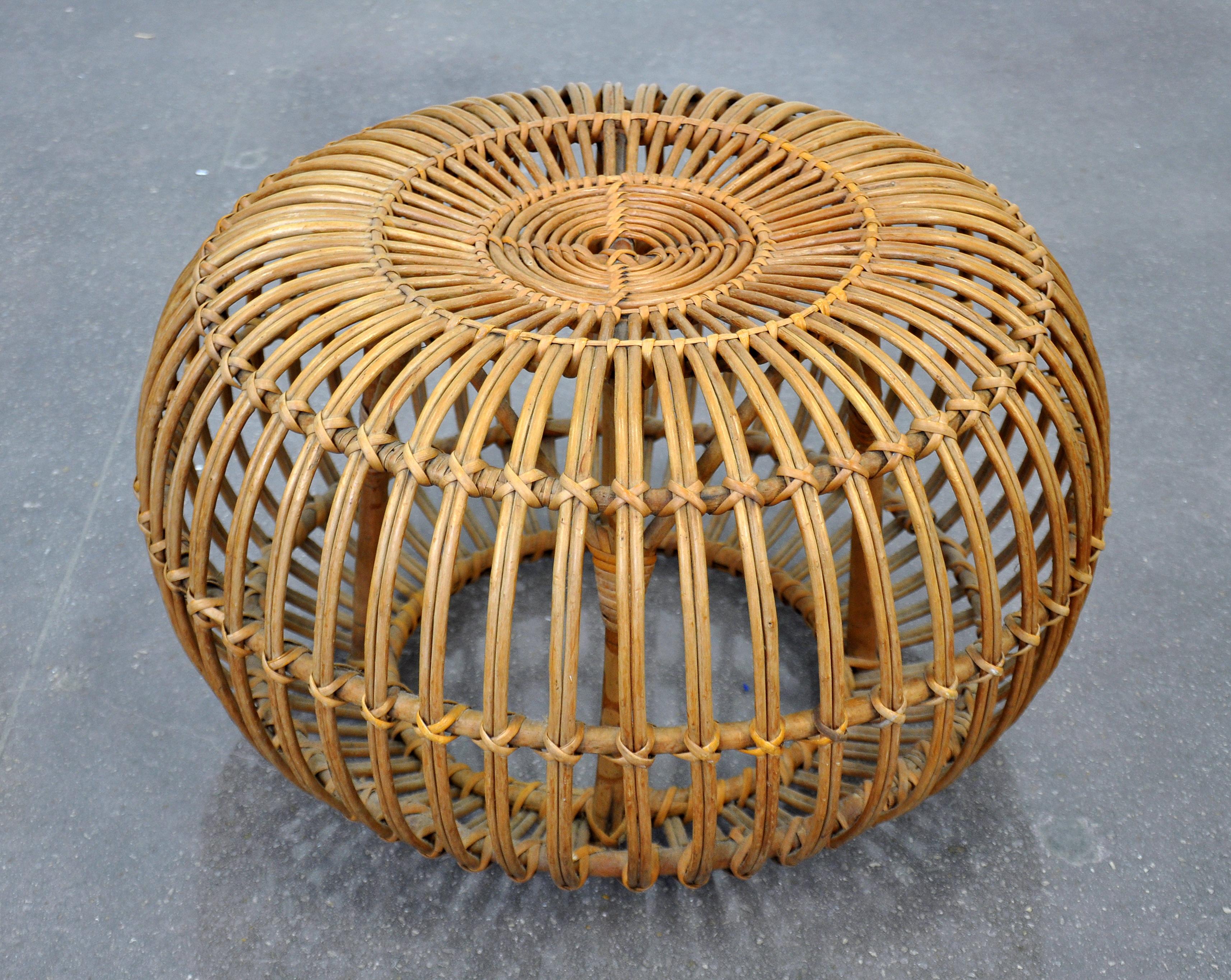 A vintage Mid-Century Modern circular pouf designed by Franco Albini in the 1950s and manufactured by Vittorio Bonacina in the 1960s. An ingeniously designed stool that's composed solely of bent-rattan weaving makes for a Classic and stylish piece.