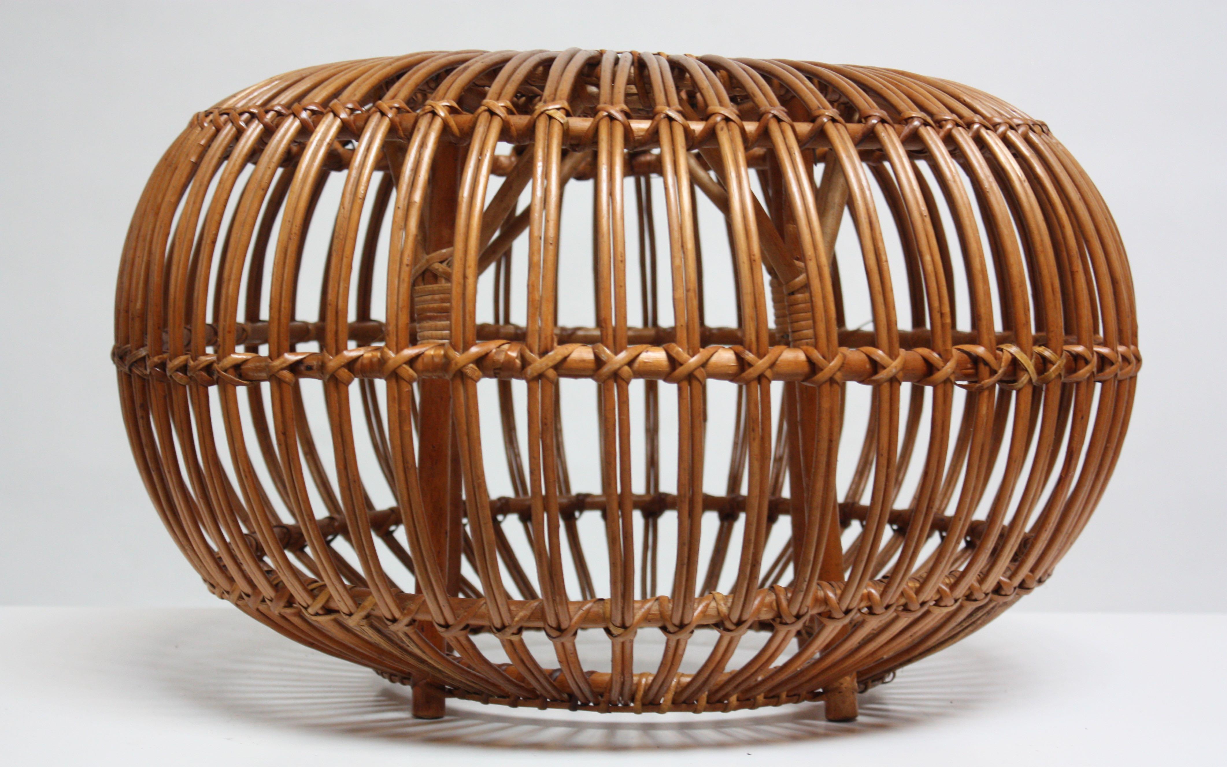This rattan pouf or ottoman was designed by Franco Albini for Vittorio Bonacina in the 1950s and is composed solely of bent-rattan weaving. All vertical and 'cross stitch' strands are completely intact, and the piece is in excellent, original