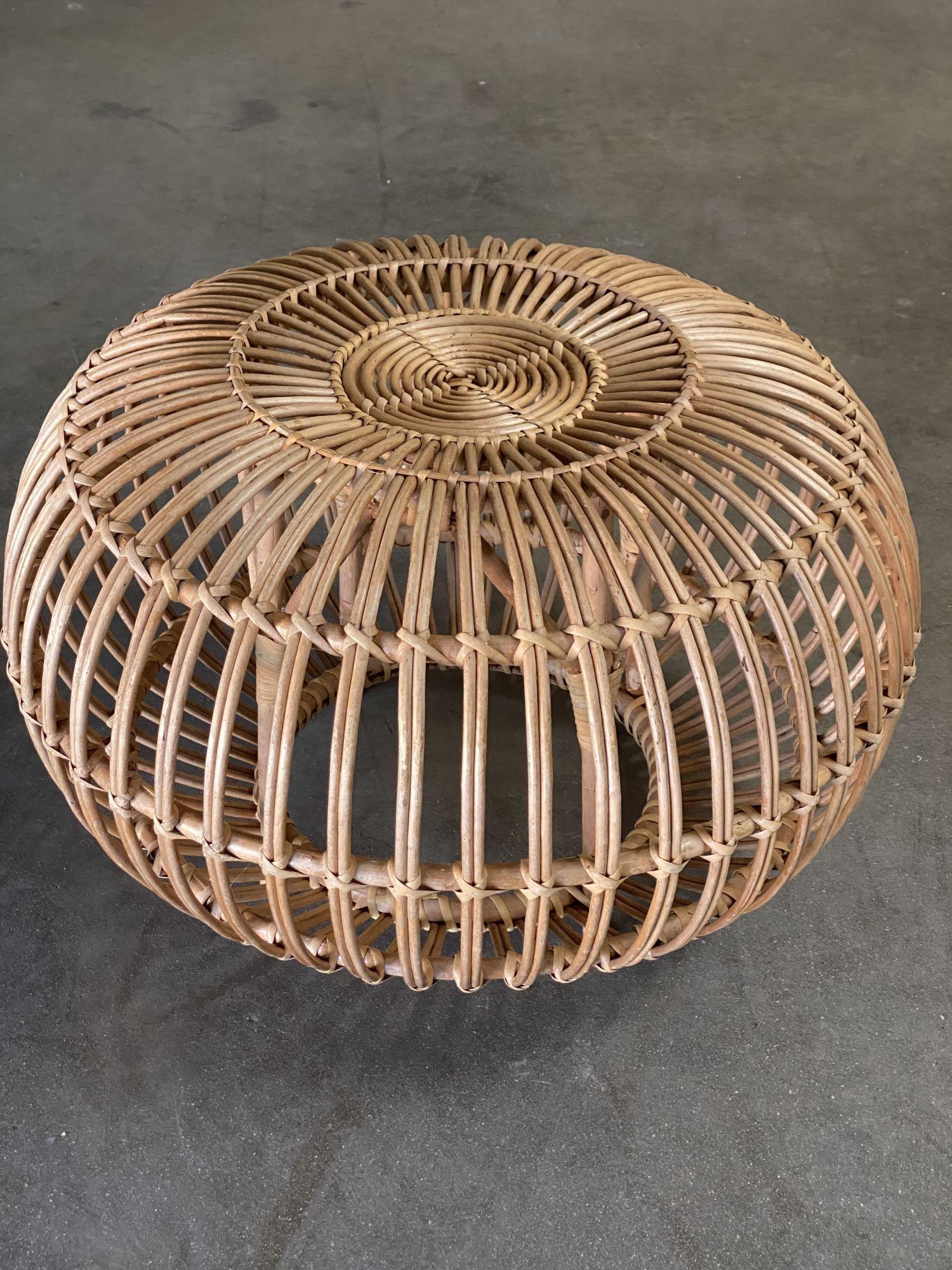 A vintage Mid-Century Modern round pouf designed by Franco Albini in the 1950s and manufactured by Vittorio Bonacina in the 1960s. An ingeniously designed stool that's composed solely of bent-rattan weaving makes for a Classic and stylish piece.