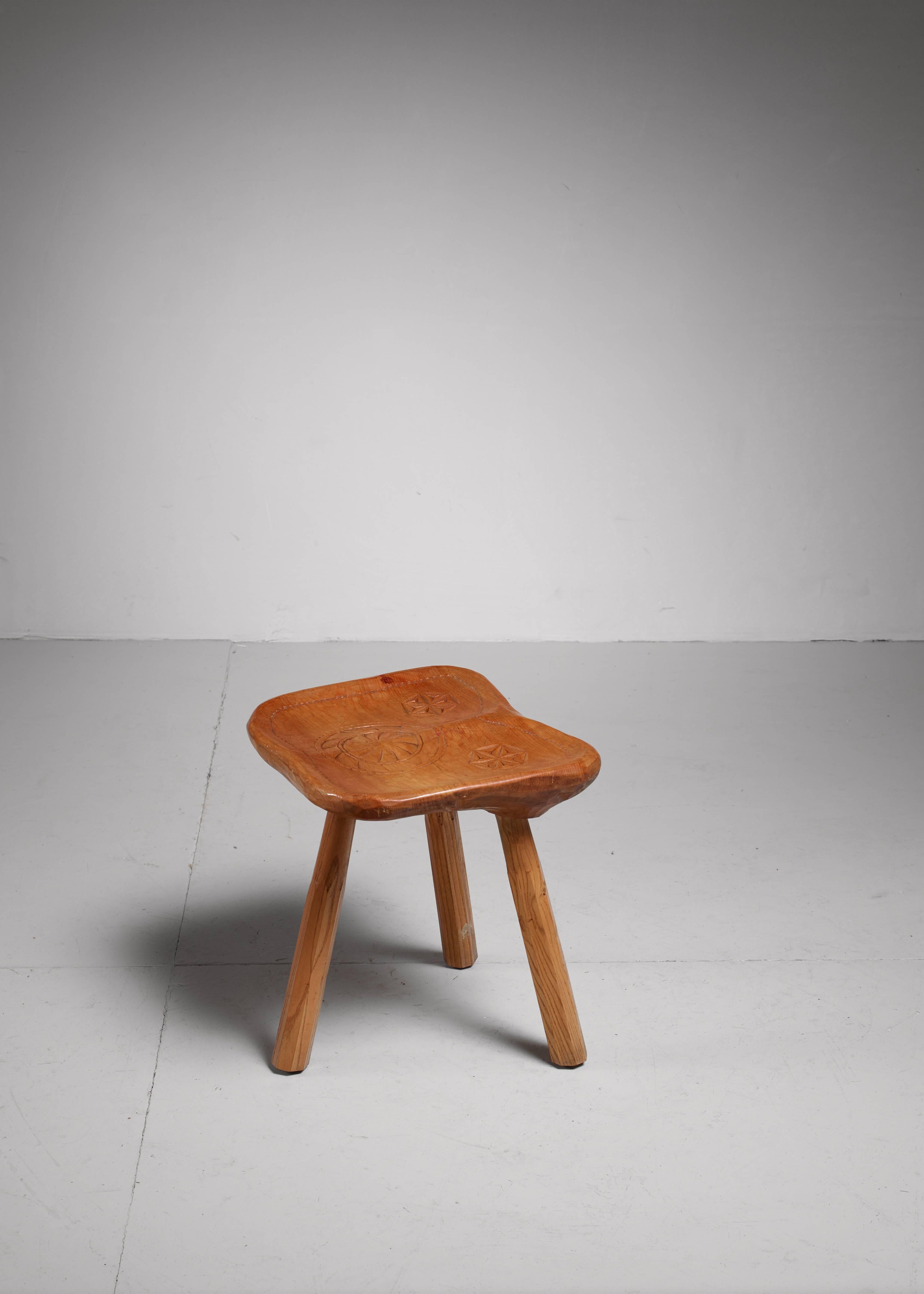 This stool is made and signed by Franco Armand, 1966. He learned the craft of his father and followed in his father's footstep after his studies. This is one of his early works. The stool is all handmade and like all his furniture made from one