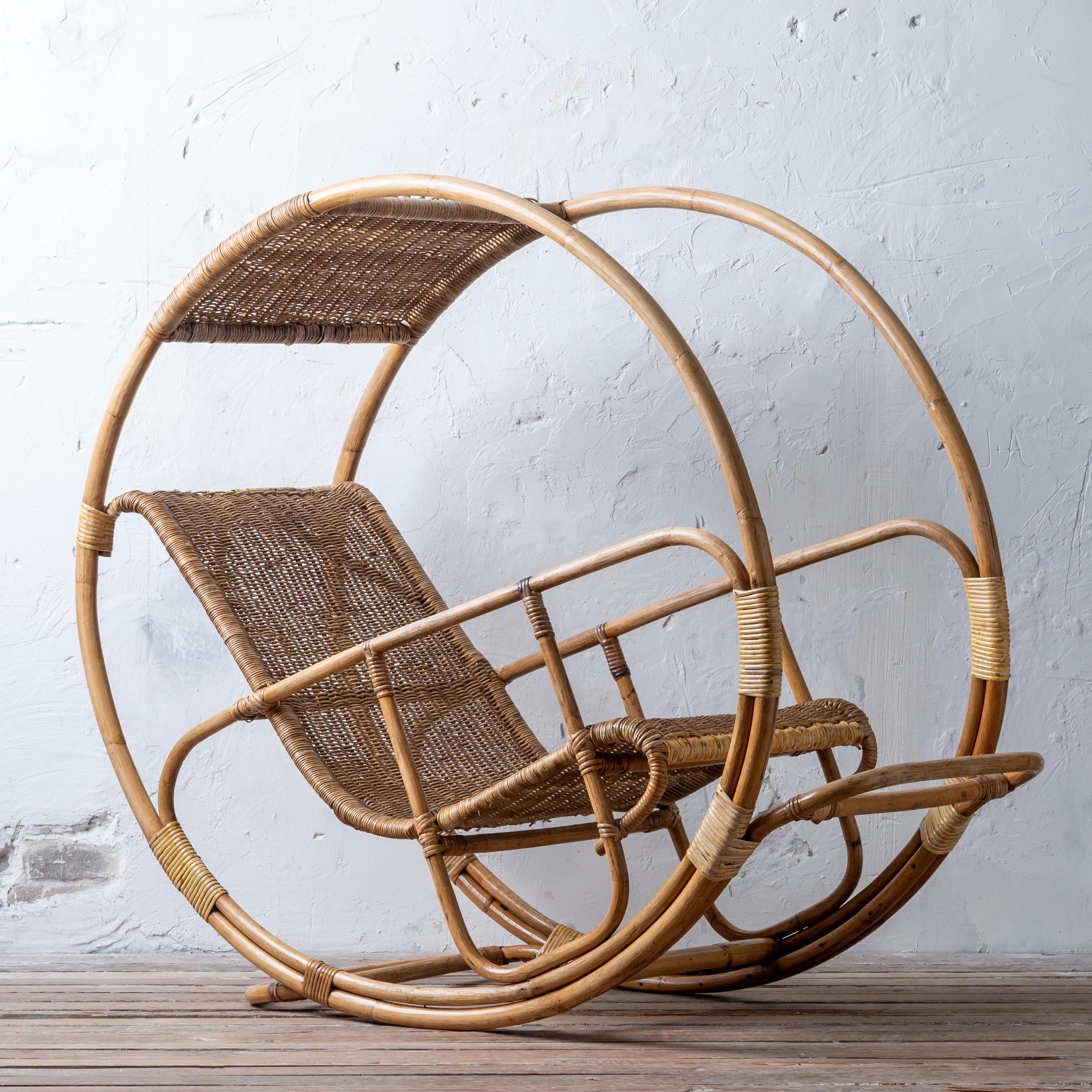 A Franco Bettonica “Dondolo” rocking lounge chair, Italy, 1964.  Rattan and Bamboo. Restored. 

24 inches wide by 57 inches deep by 48 inches tall