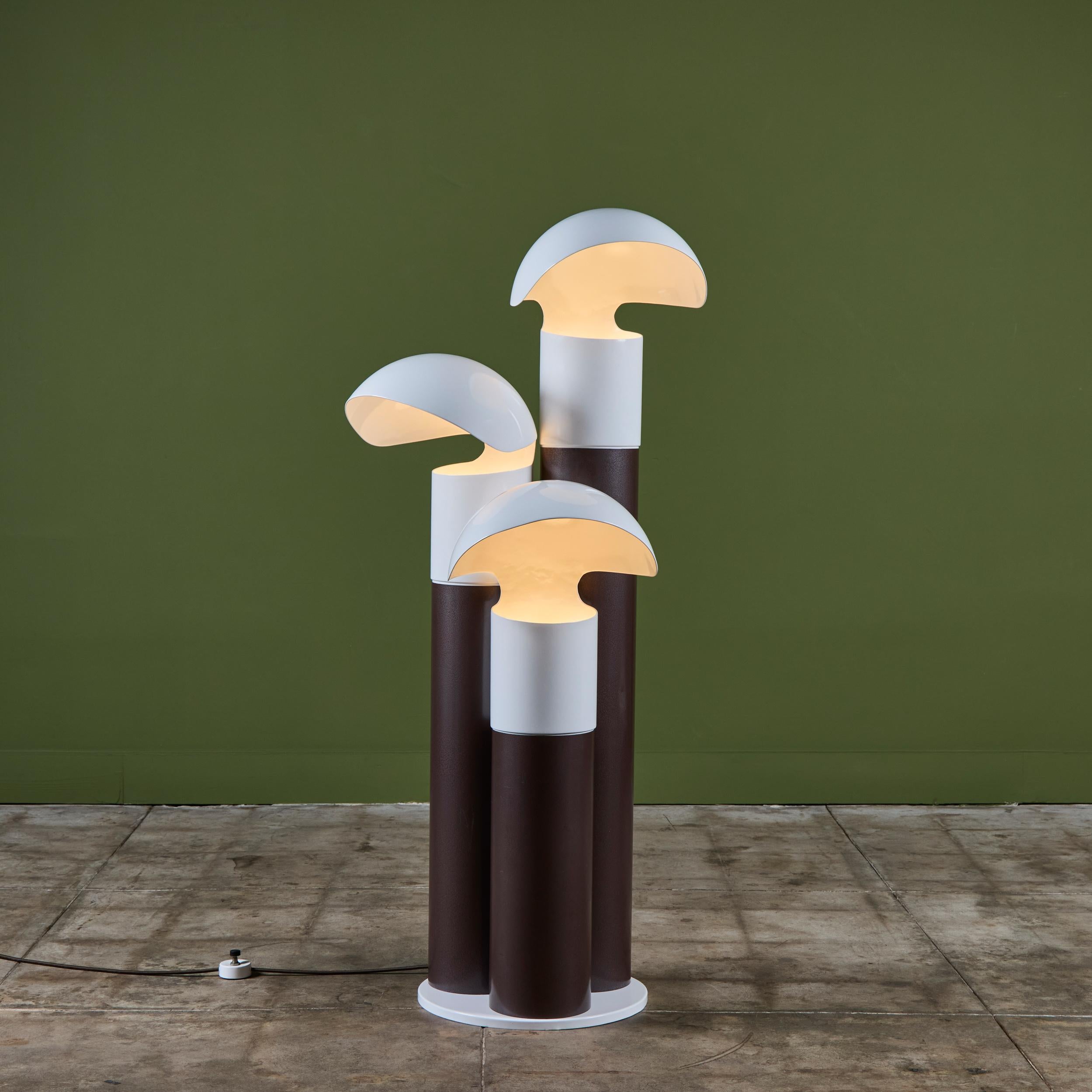Very rare Franco Buzzi Ceriani three shade floor lamp, c.1970s, Italy. The floor lamp is constructed of three brown steel tubular stems and three white powdered coated shades all on a circular round base. The foot pedal switch is located on the cord