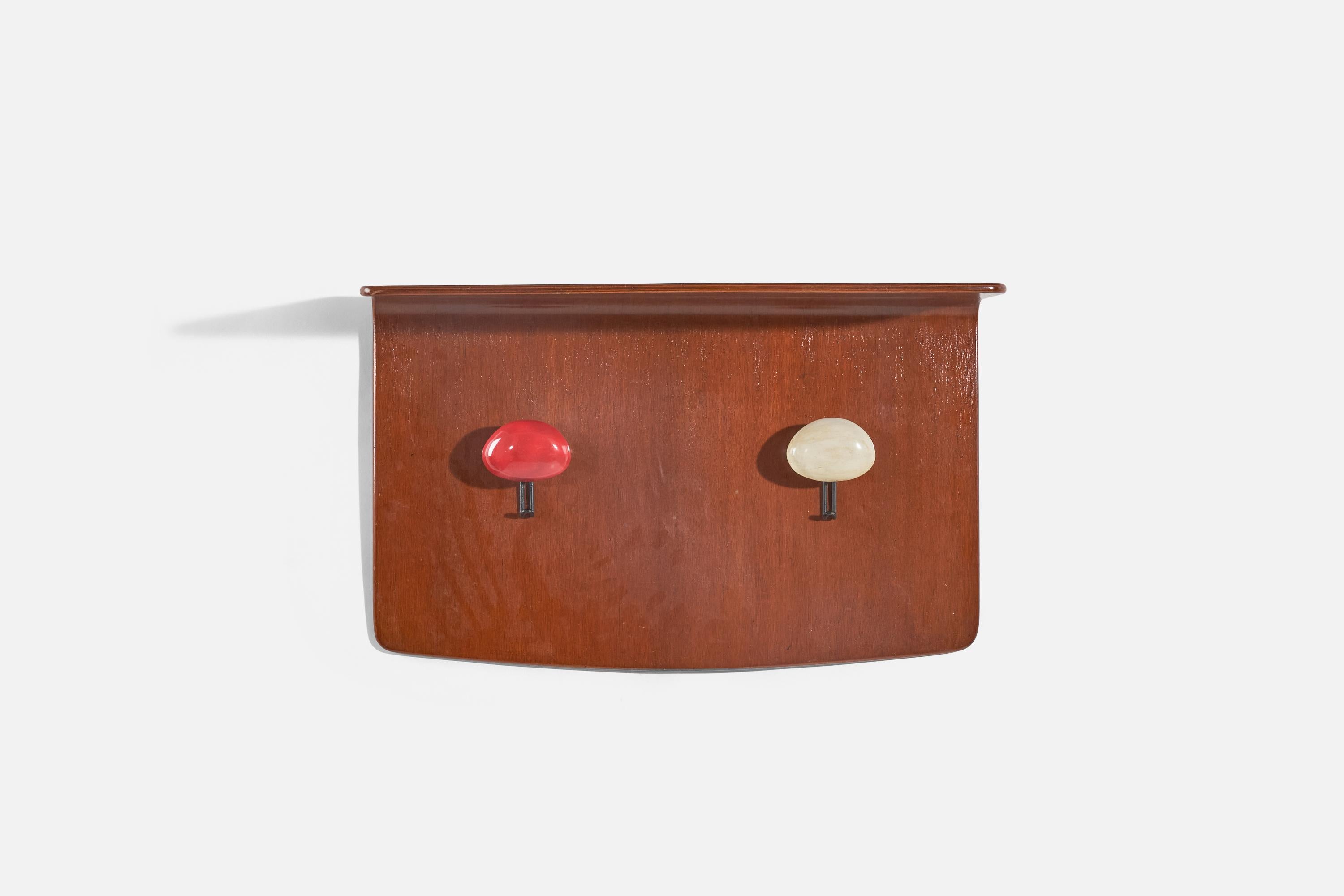 A coat rack with top shelf designed by Franco Campo and Carlo Graffi and produced by Home, Italy, 1950s. In plywood, black-lacquered metal, and red and white-painted solid wood.
  