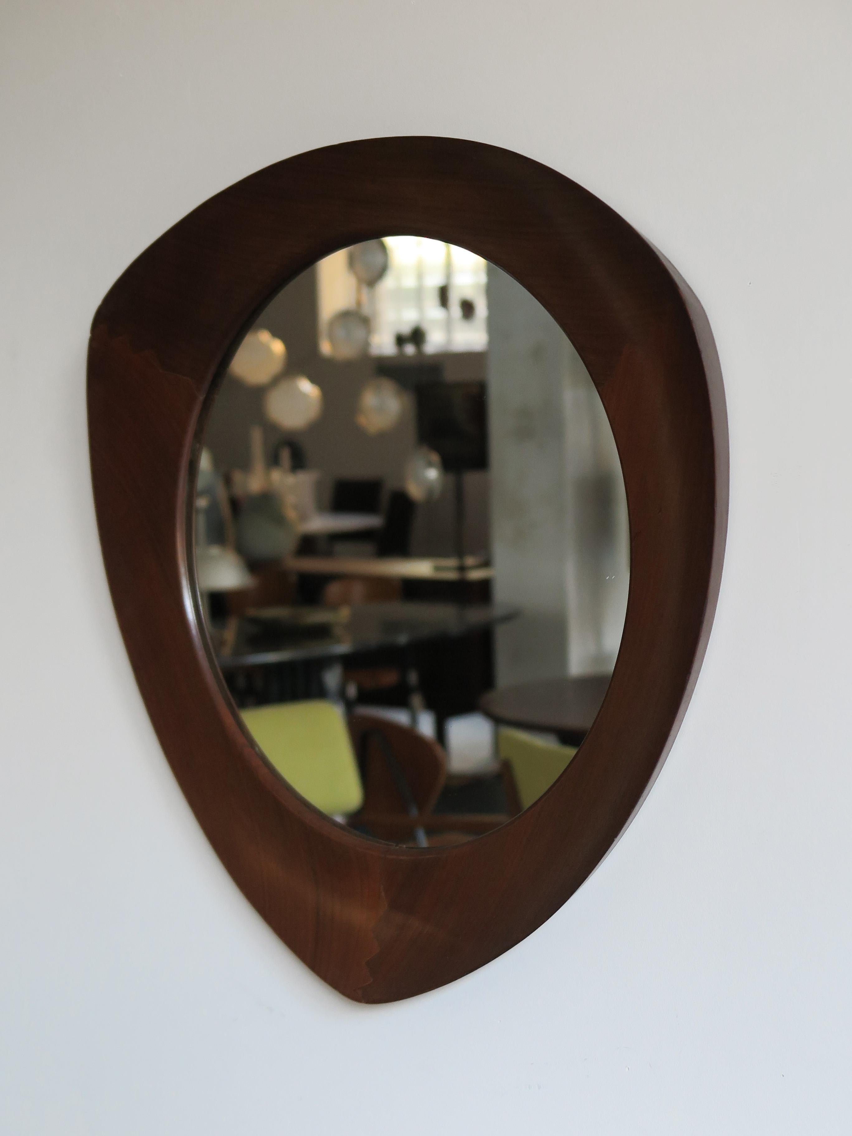 Amazing Mid-Century Modern design wall mirror designed by Franco Campo & Carlo Graffi for Home with wonderful triangular shaped interlocking frame in solid wood, 1950s

Bibliography:
I. de Guttry, M. P. Maino, Italian furniture from the 1940s and
