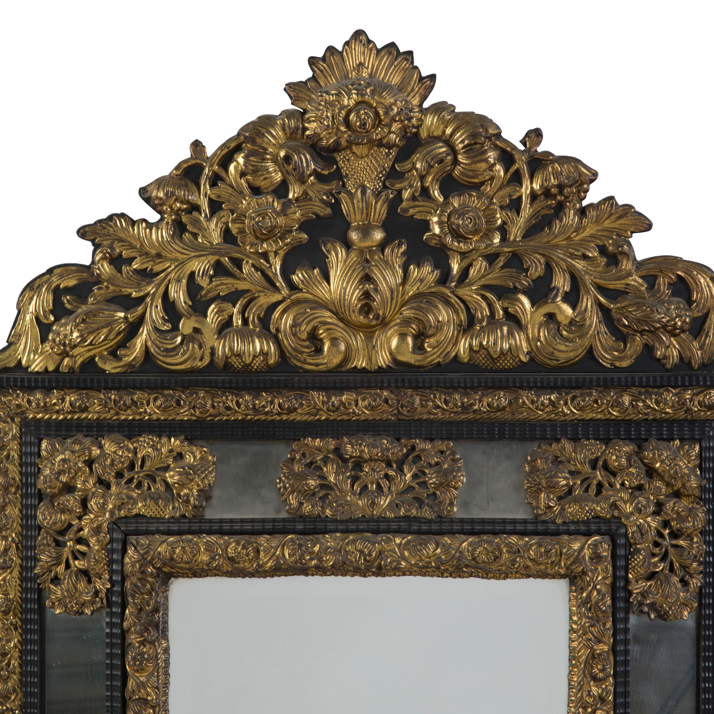 A Franco - Flemish repousse mirror, mid-19th century.