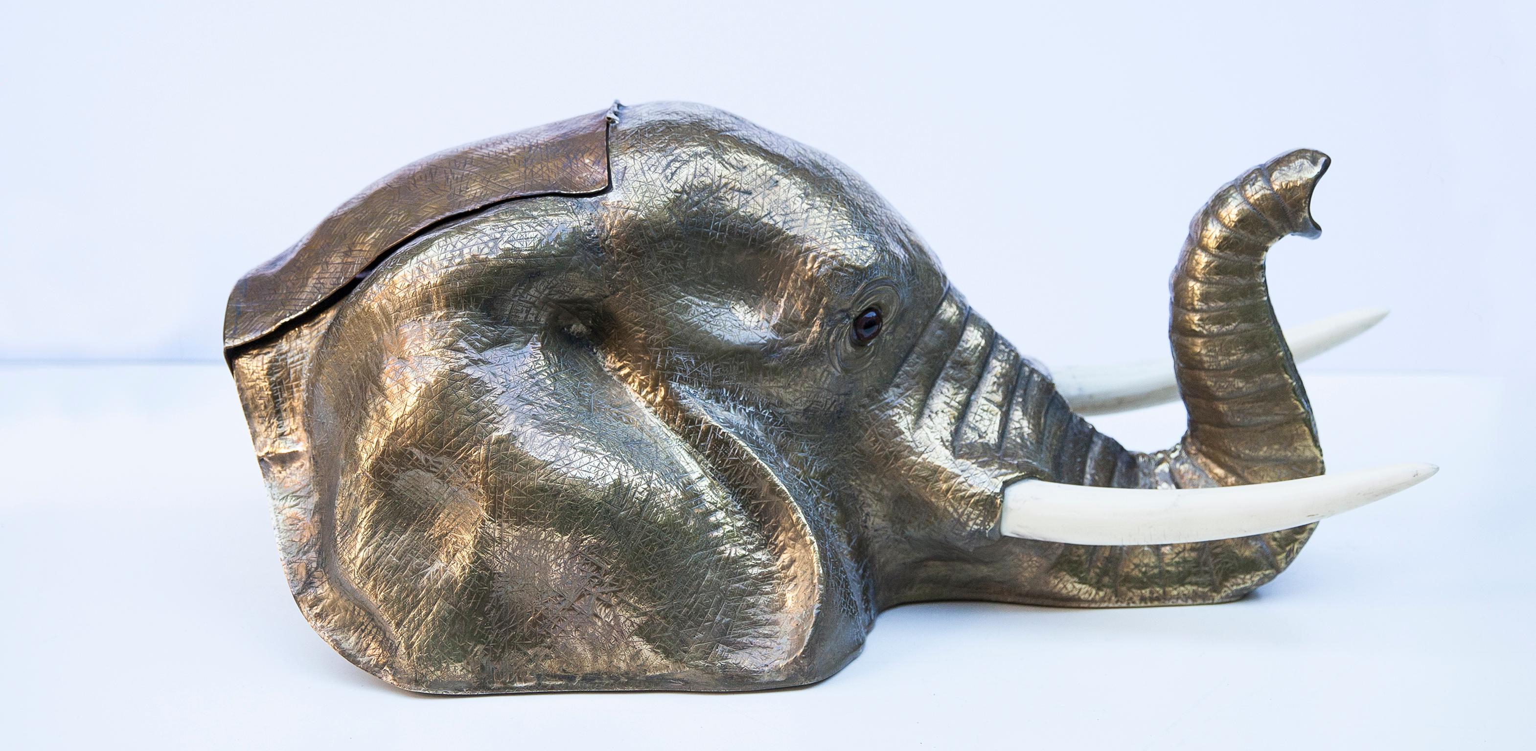 Franco Lapinis exquisite vintage elephant sculpture is made entirely of metal-plated in silver and gold and its surface is lightly textured to give it an organic feel, the fake ivory horns gracing a striking contrasts to the silver with its ivory