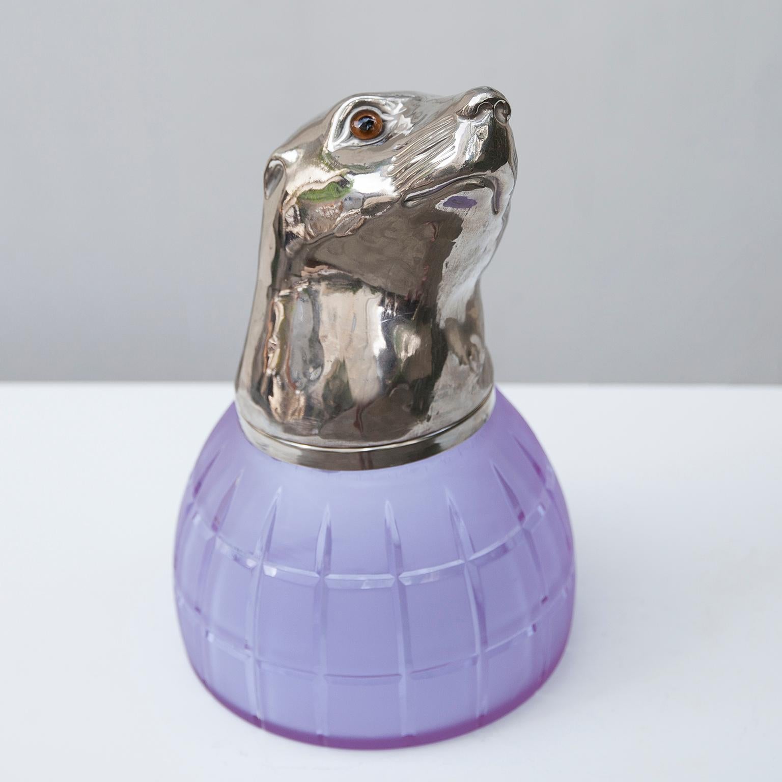 Franco Lapini exquisite seal sculpture is made entirely of metal plated in silver and its surface is lightly textured to give it an organic feel, the purple Murano glass gracing a striking contrasts to the silver. You can open the head and use for