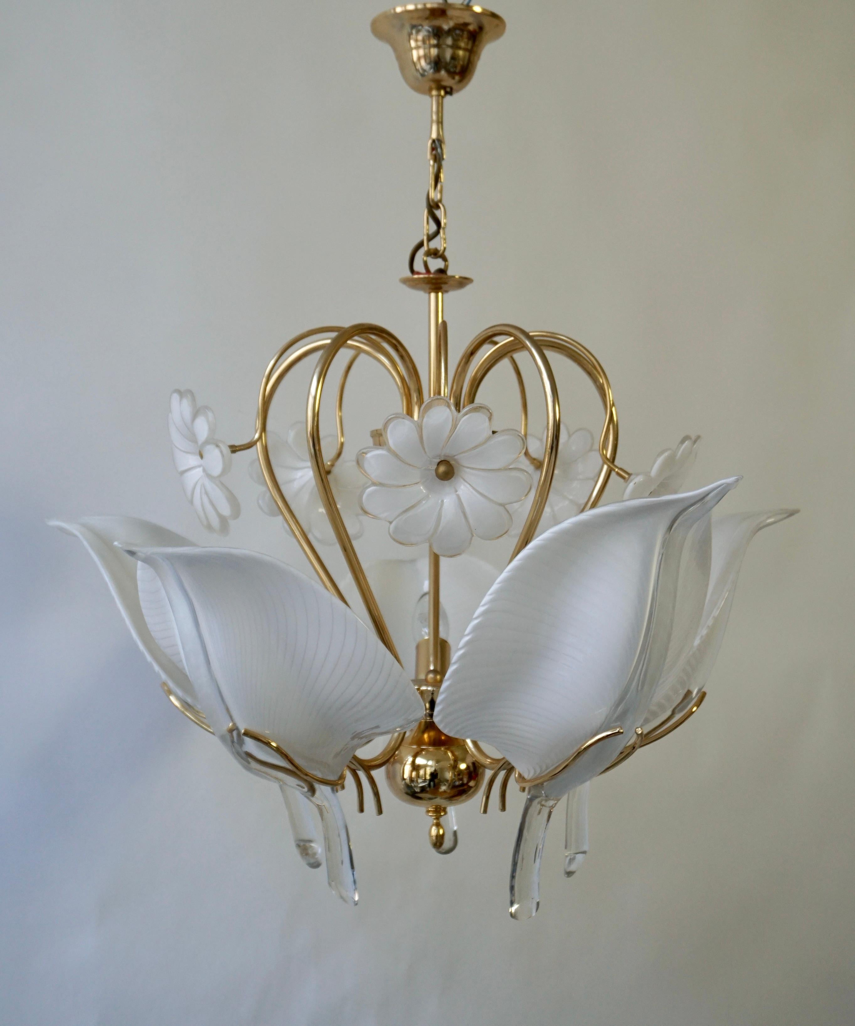 Amazing Mid-Century Modern Vintage Murano glass five light pendant chandelier. 
Design by Franco Luce for Seguso. 
Striking Italian design from the 1970s. 
Handcrafted forged metal frame with original gilt finish. The five original Murano leaves and